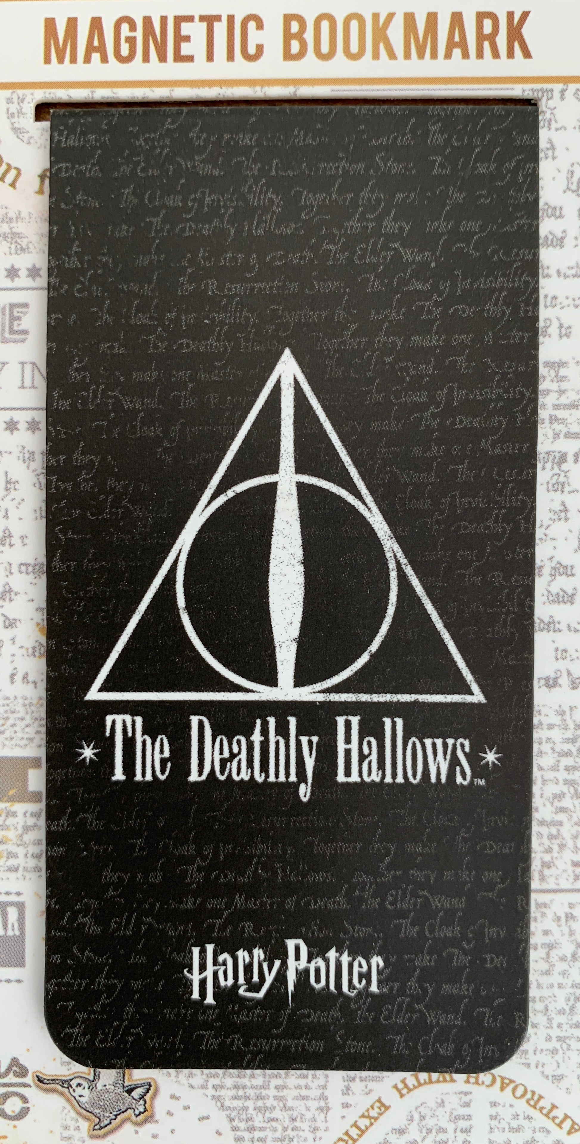 Magnetic bookmark with 'The Deathly Hallows' design on a Harry Potter-themed background