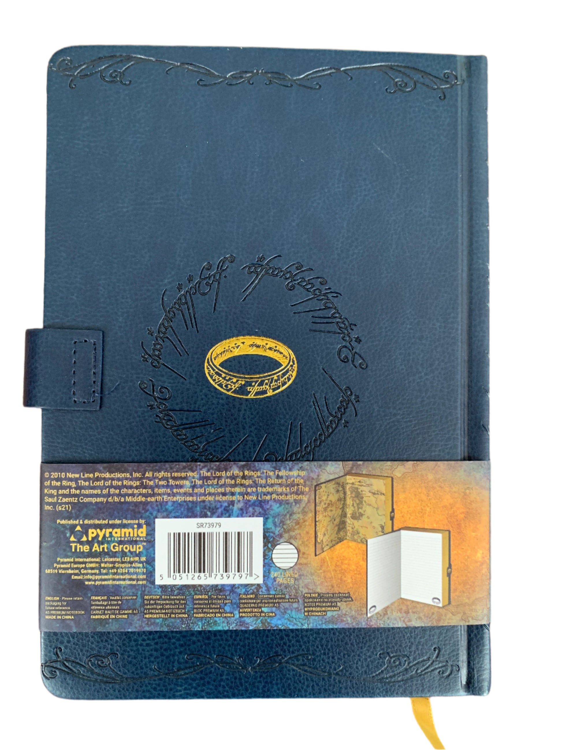 Blue leather-bound book with gold embossed design on a white background