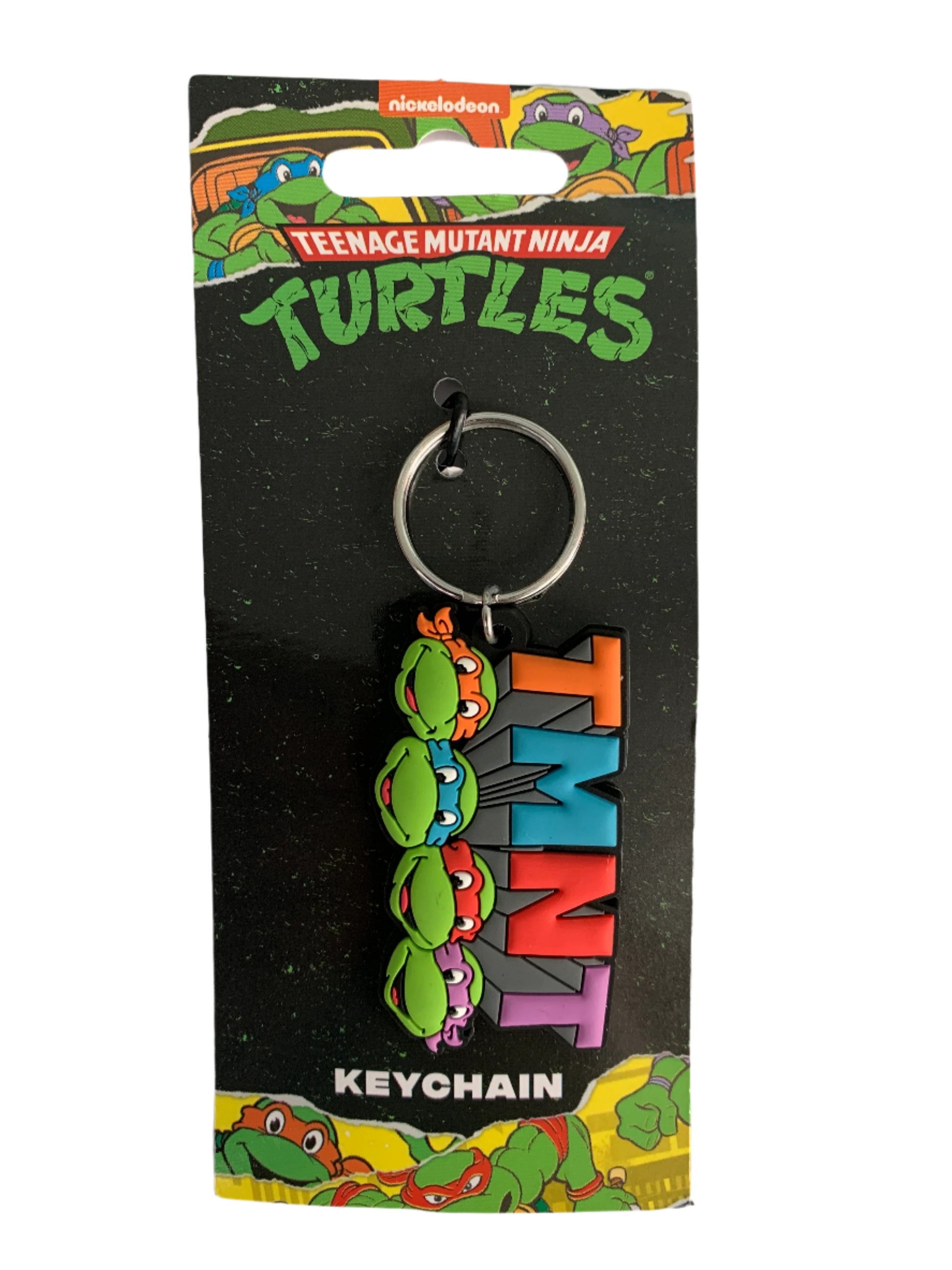 TMNT keychain on a black card with colorful graphics