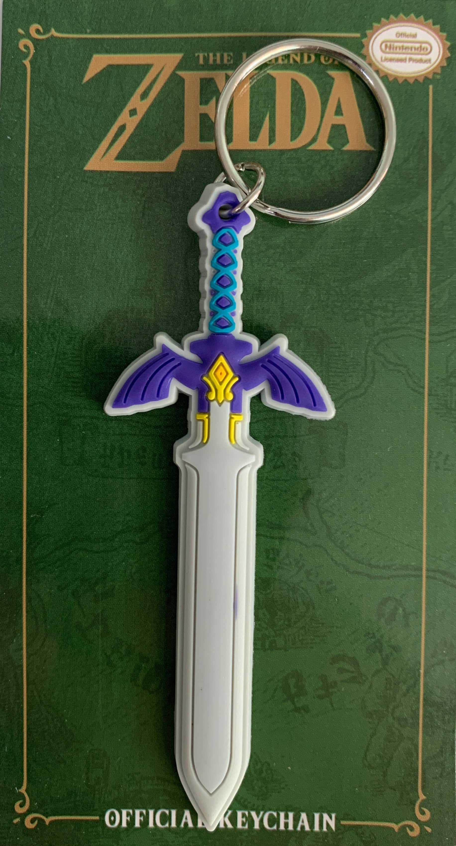 Keychain of a sword design on a green card with 'The Legend of Zelda' branding.