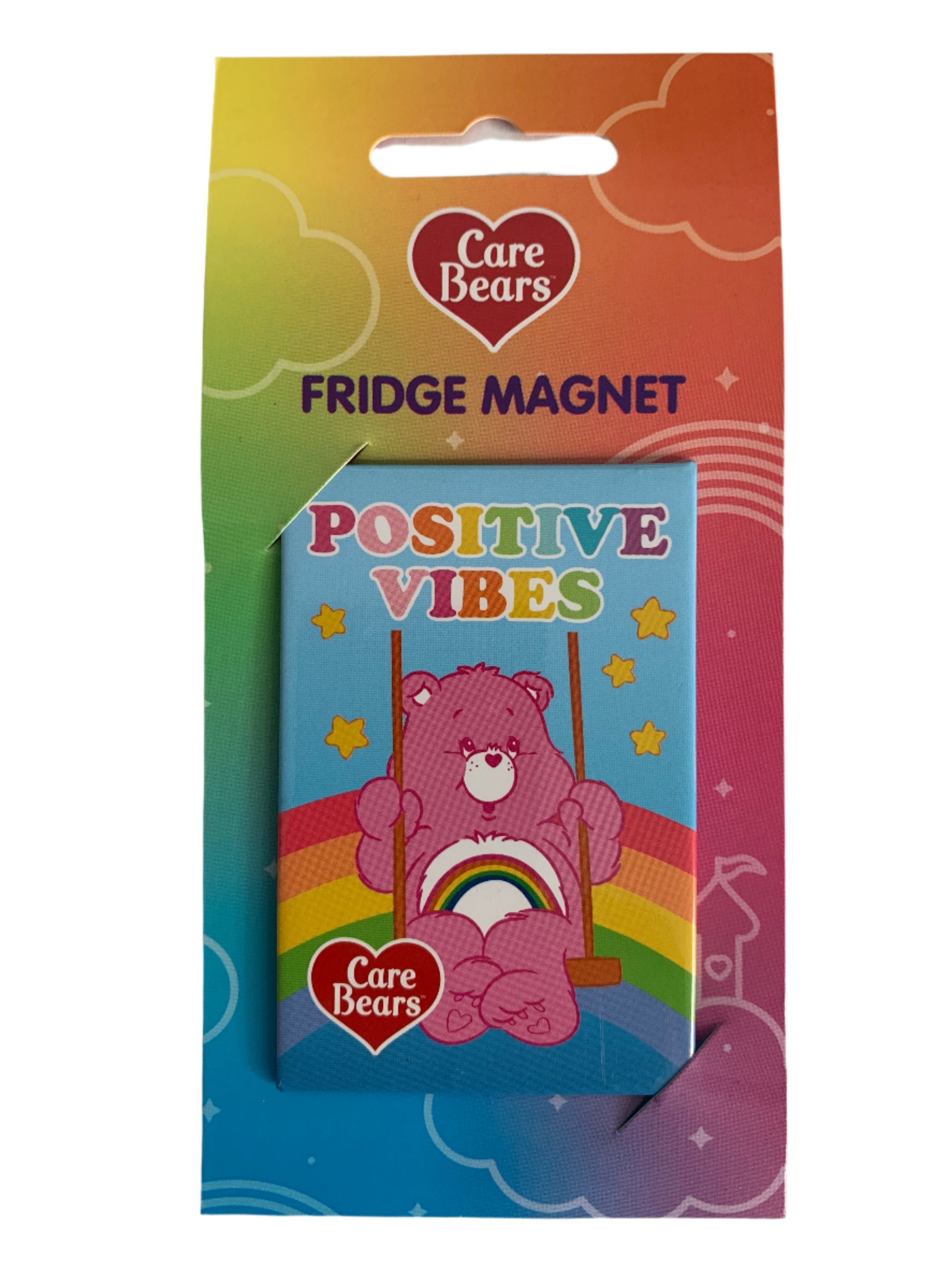 Care Bears fridge magnet packaging with a pink bear and rainbow design on a white background