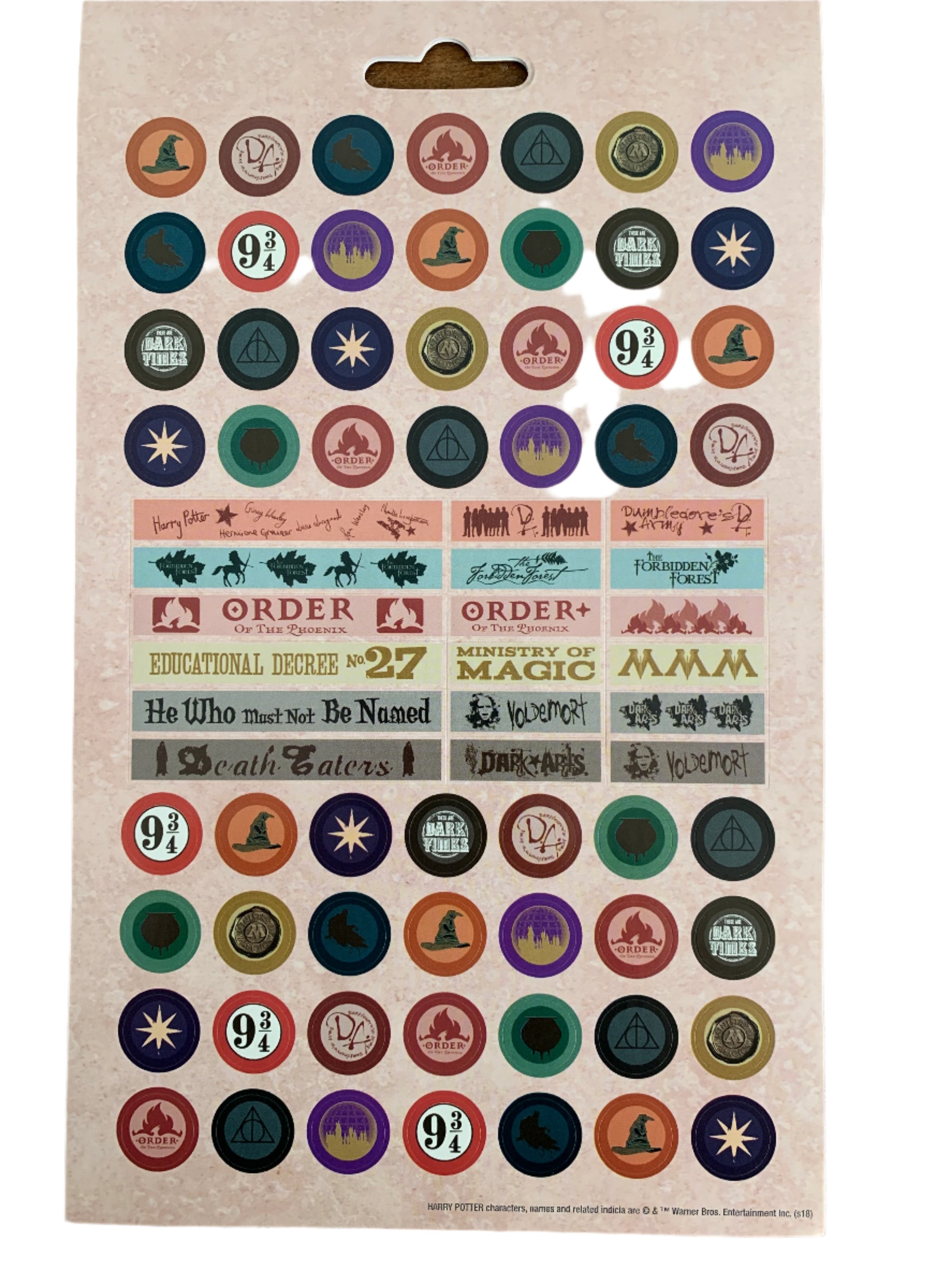 Collection of colorful circular stickers on a beige card with text