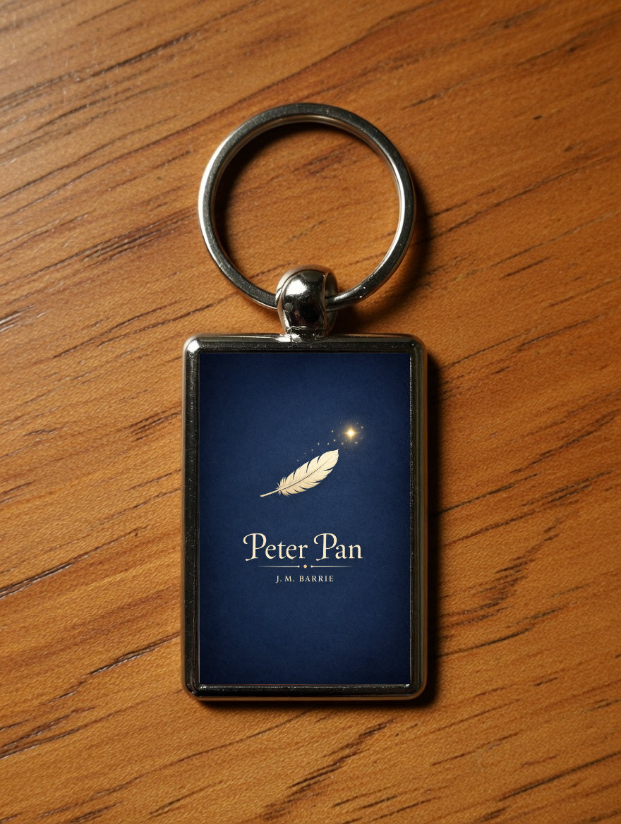 Peter Pan metal keyring on a wooden table