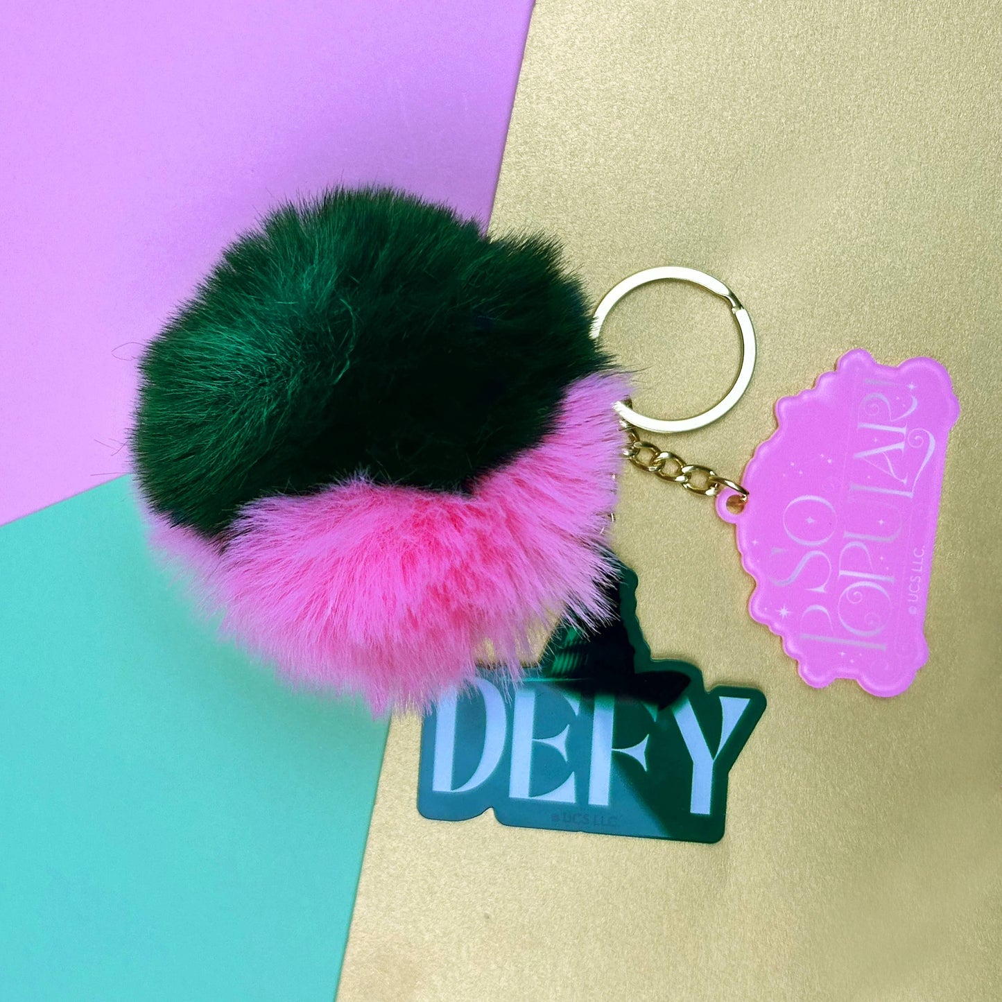Wicked Pom Pom Keyring – Officially Licensed, Glinda & Elphaba Acrylic Charms