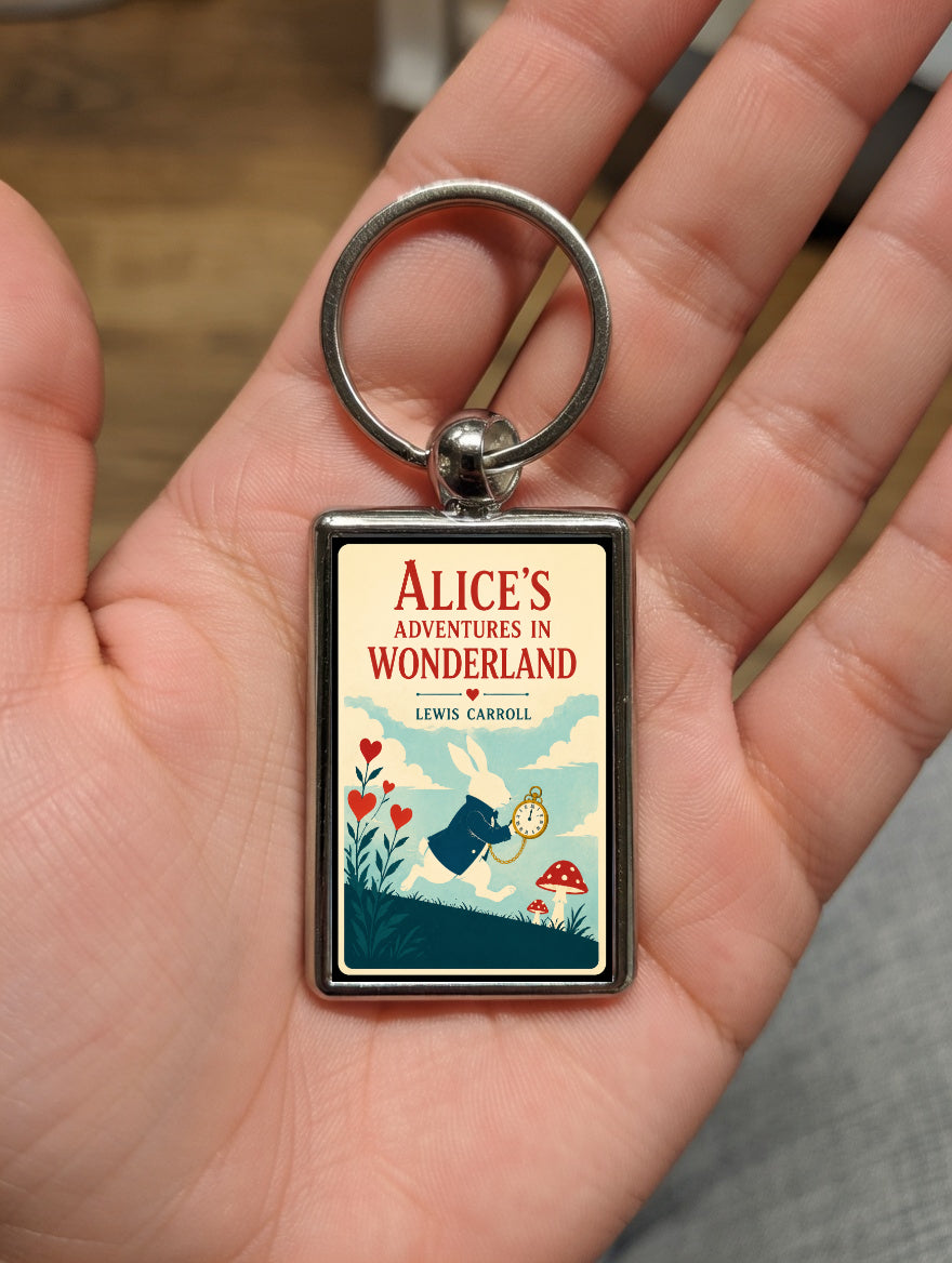 Alice’s Adventures in Wonderland White Rabbit metal keyring shown in a hand