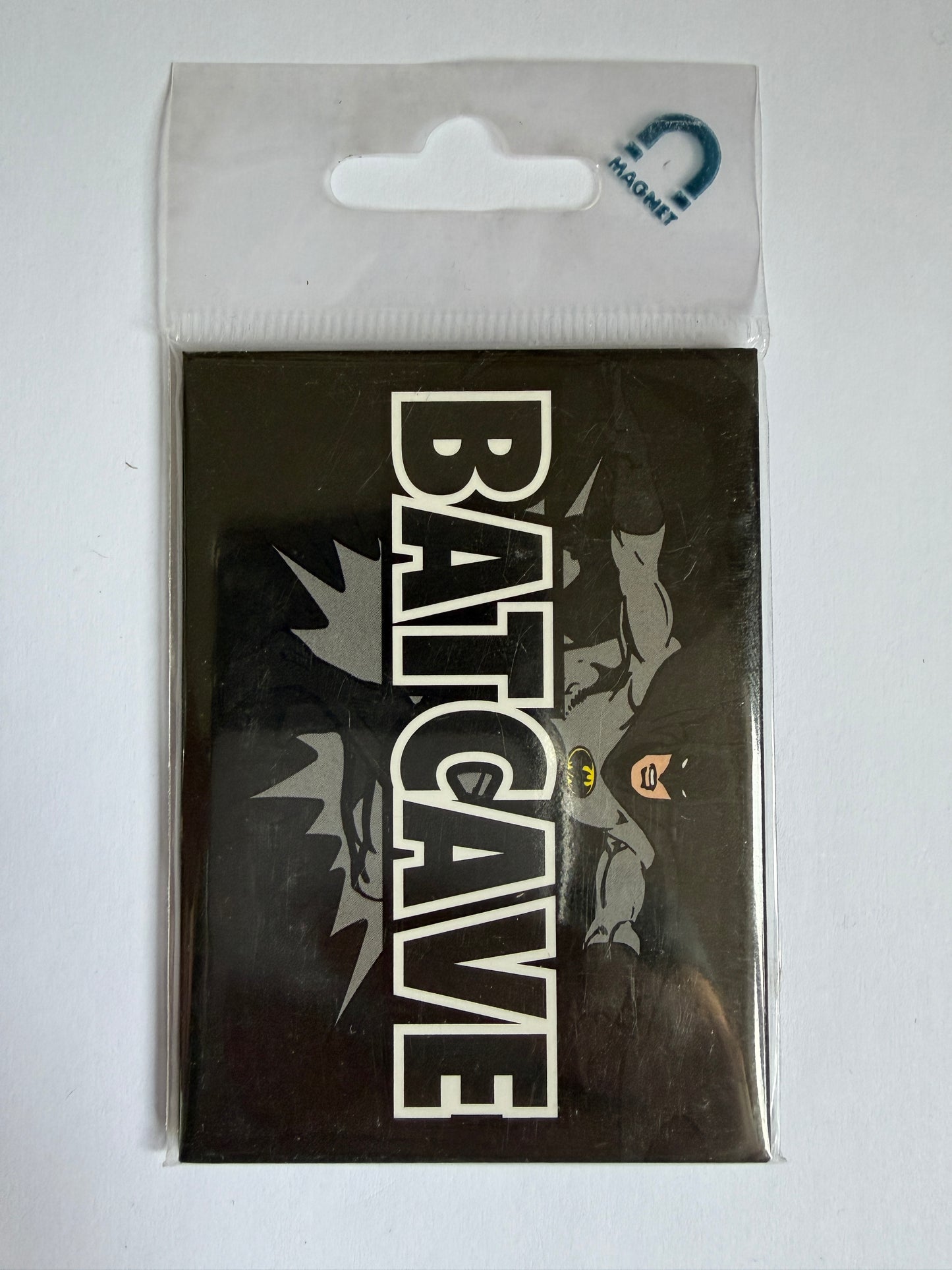 Fridge Magnet with Batman design and 'Batcave' text on a clear background