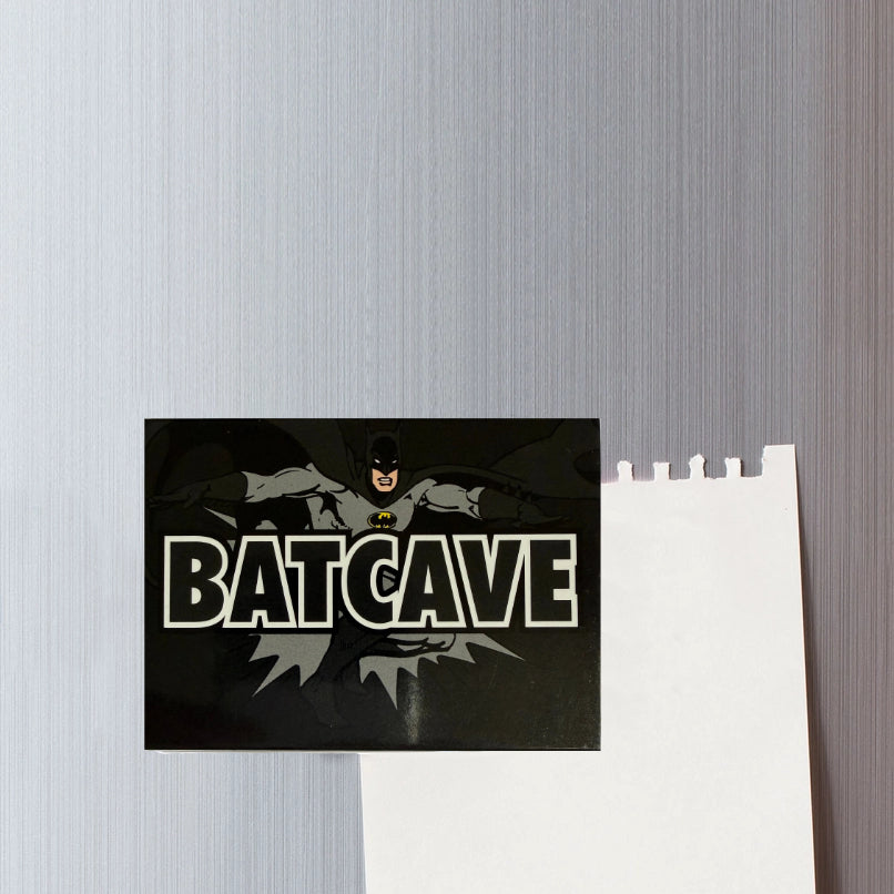 Decorative magnet with Batman graphic and 'Batcave' text on a textured wall.