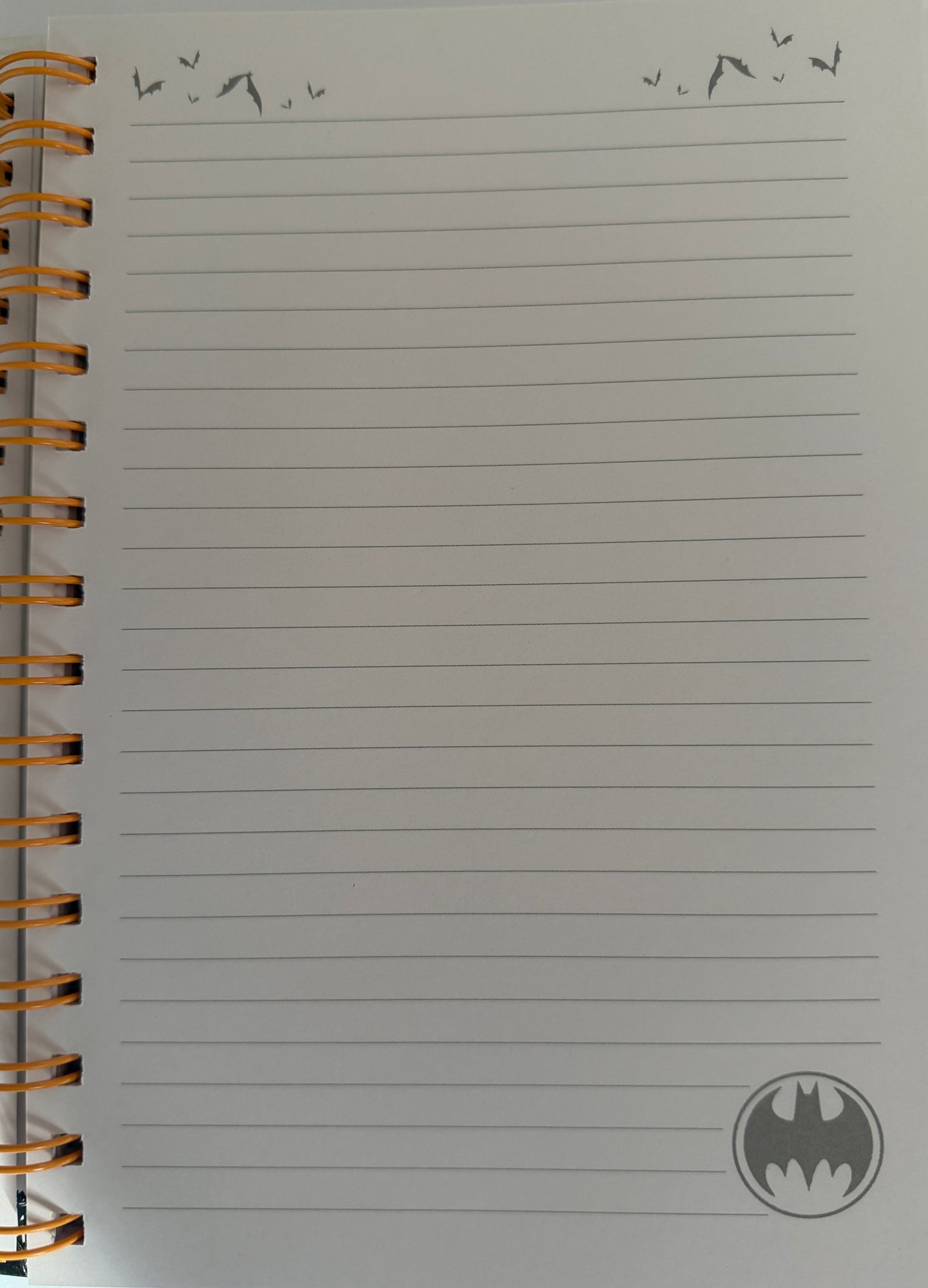 Notebook with lined pages and a logo on a white background