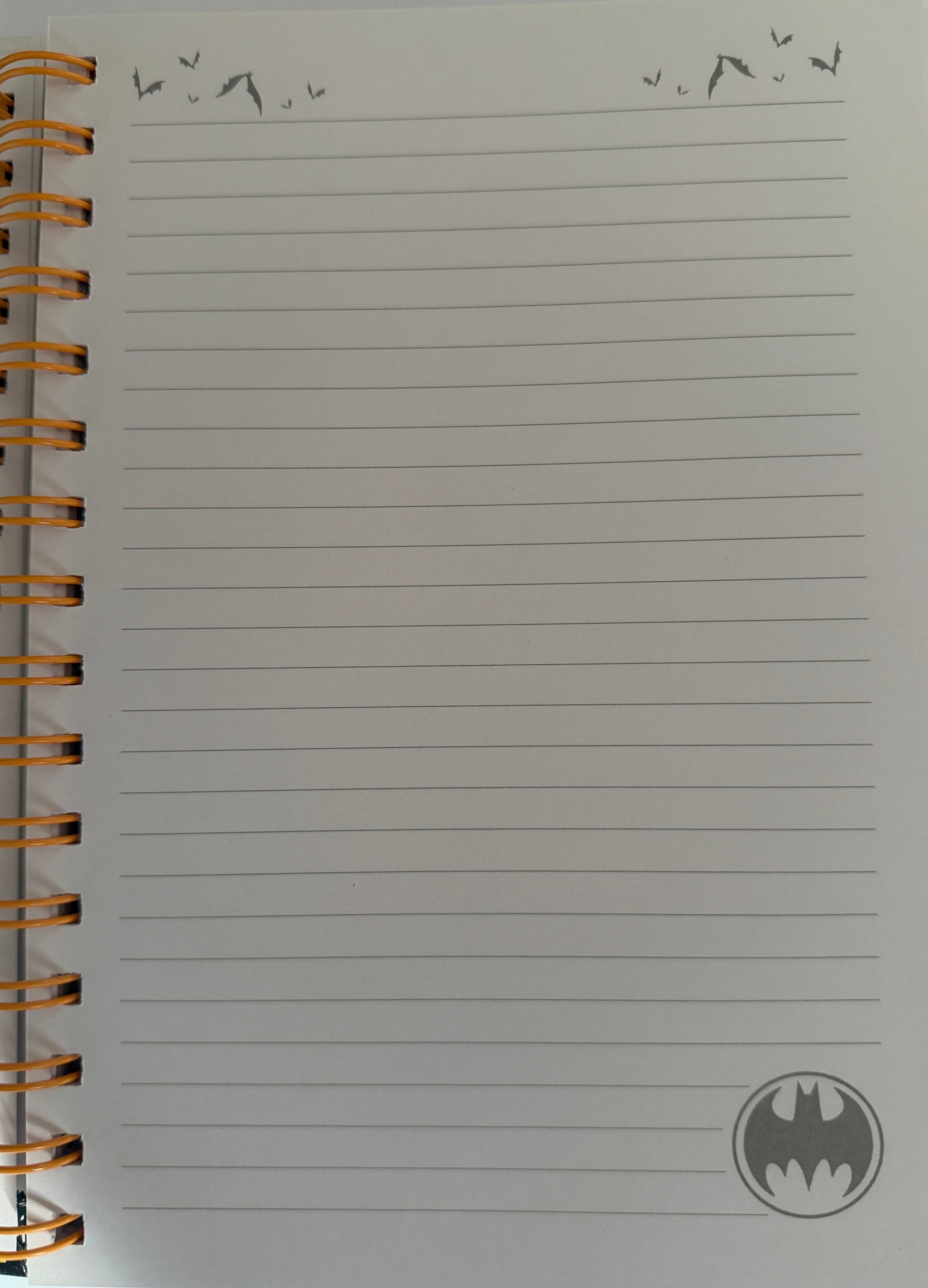 Notebook with lined pages and a logo on a white background