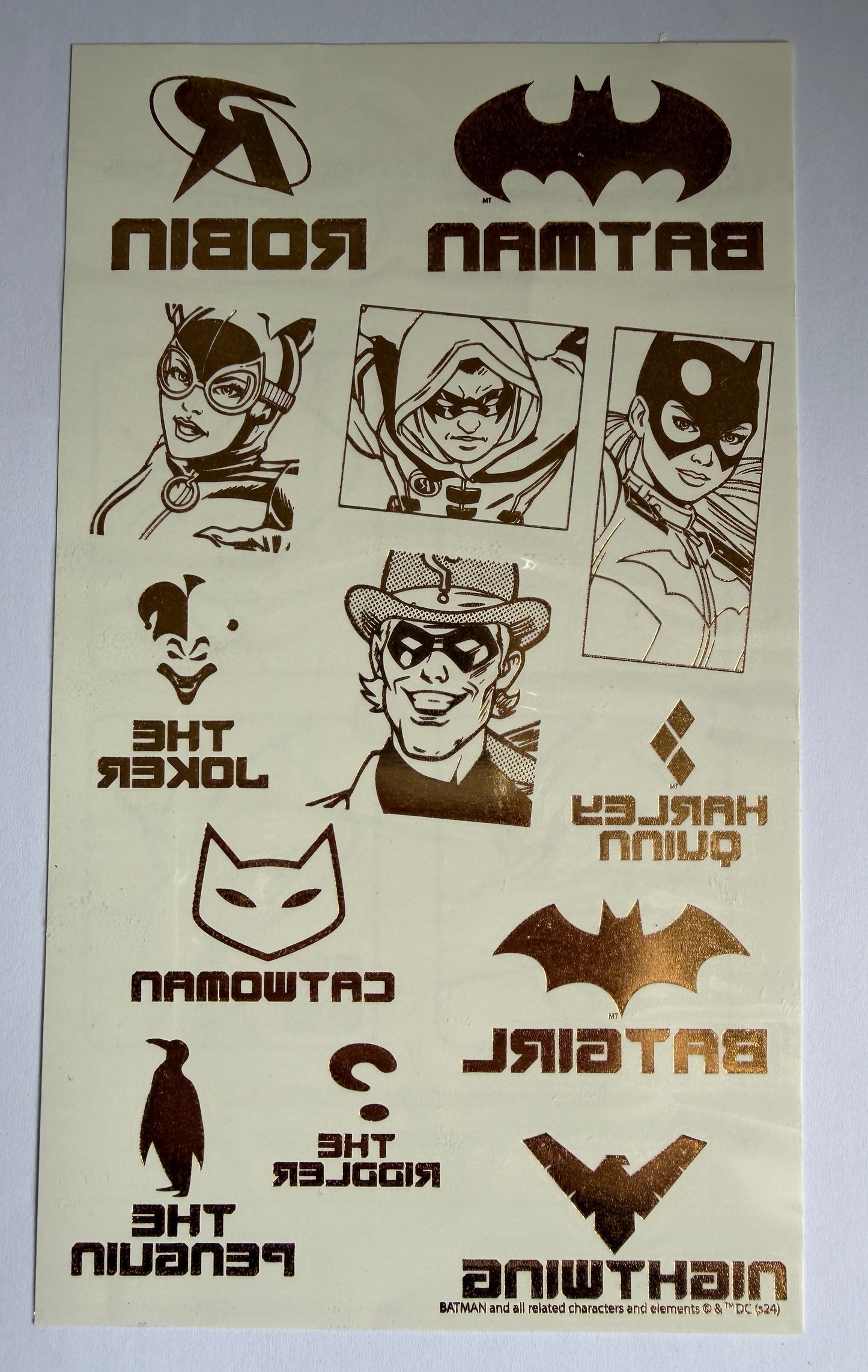 Batman-themed temporary tattoos with character illustrations and names on a white background