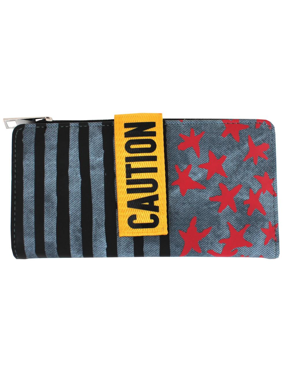 Hand holding a striped wallet with a 'Caution' label on a white background