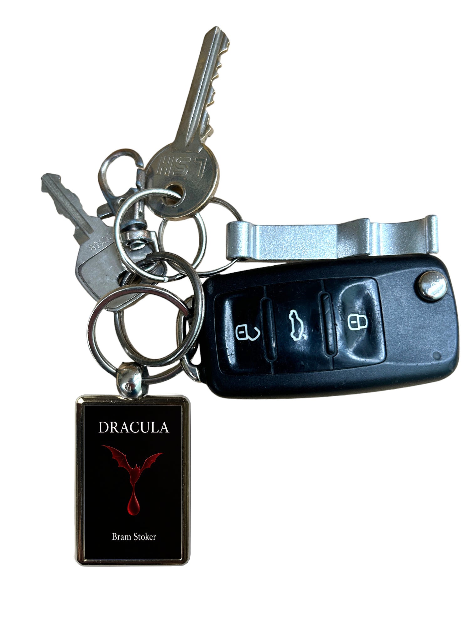 A novelty keychain set featuring a black car key fob, two metal keys on a split ring, and a rectangular black tag with the word 'DRACULA' and a red bird emblem.