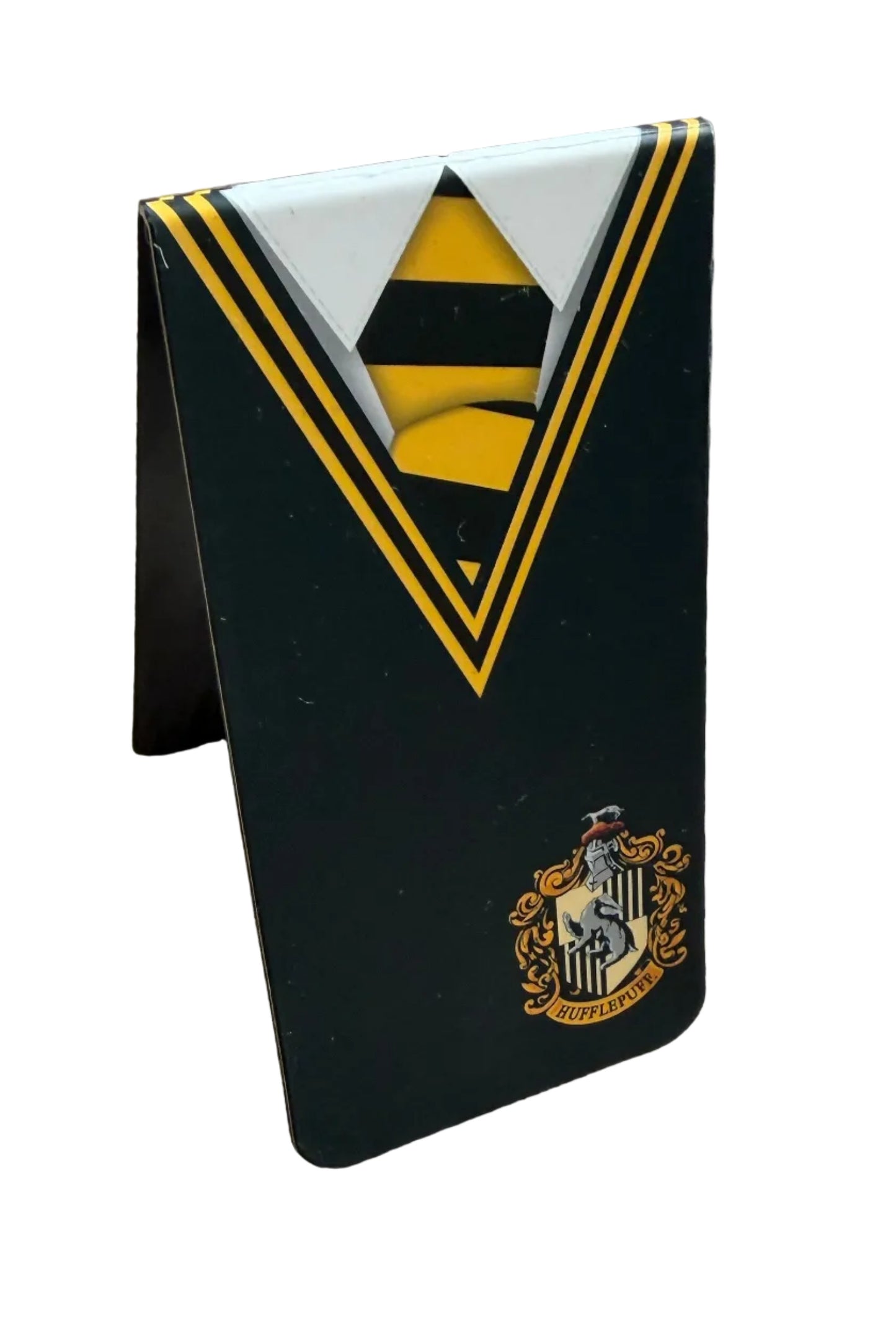 Bookmark with gold and white design on a wooden surface, Hufflepuff design