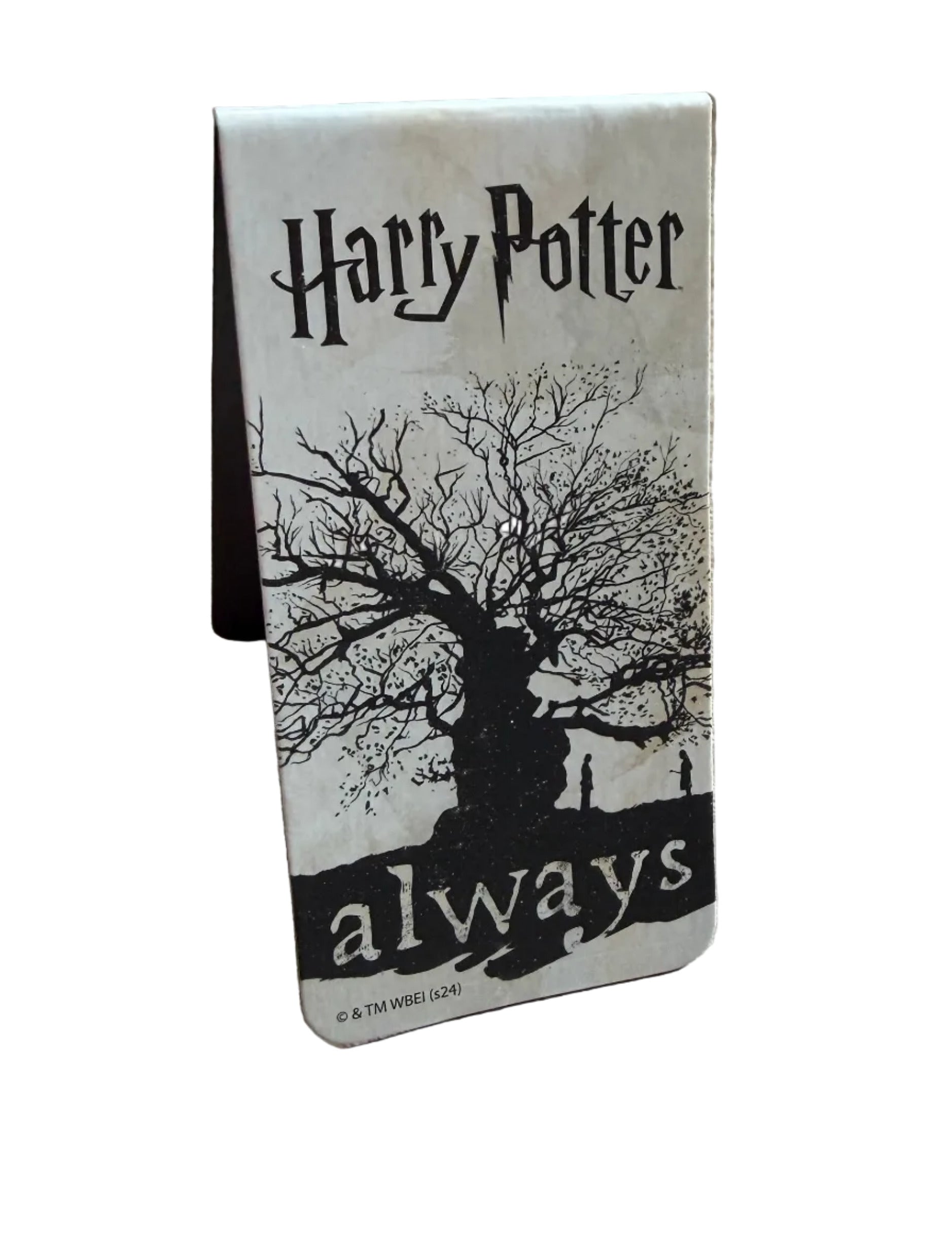 Bookmark titled 'Harry Potter' with a tree illustration on a wooden surface