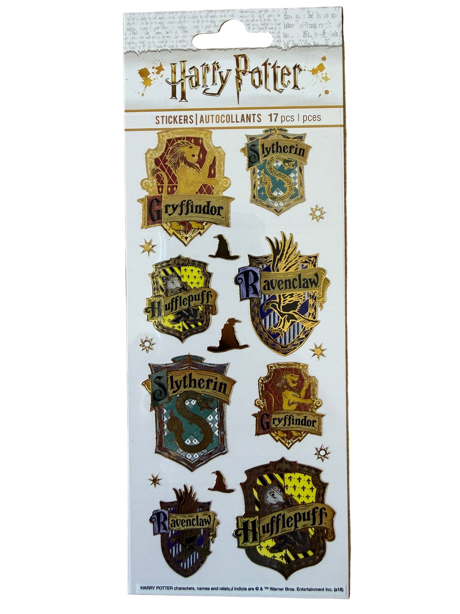 Harry Potter enamel-style sticker sheet showing Gryffindor, Ravenclaw, Slytherin and Hufflepuff crests