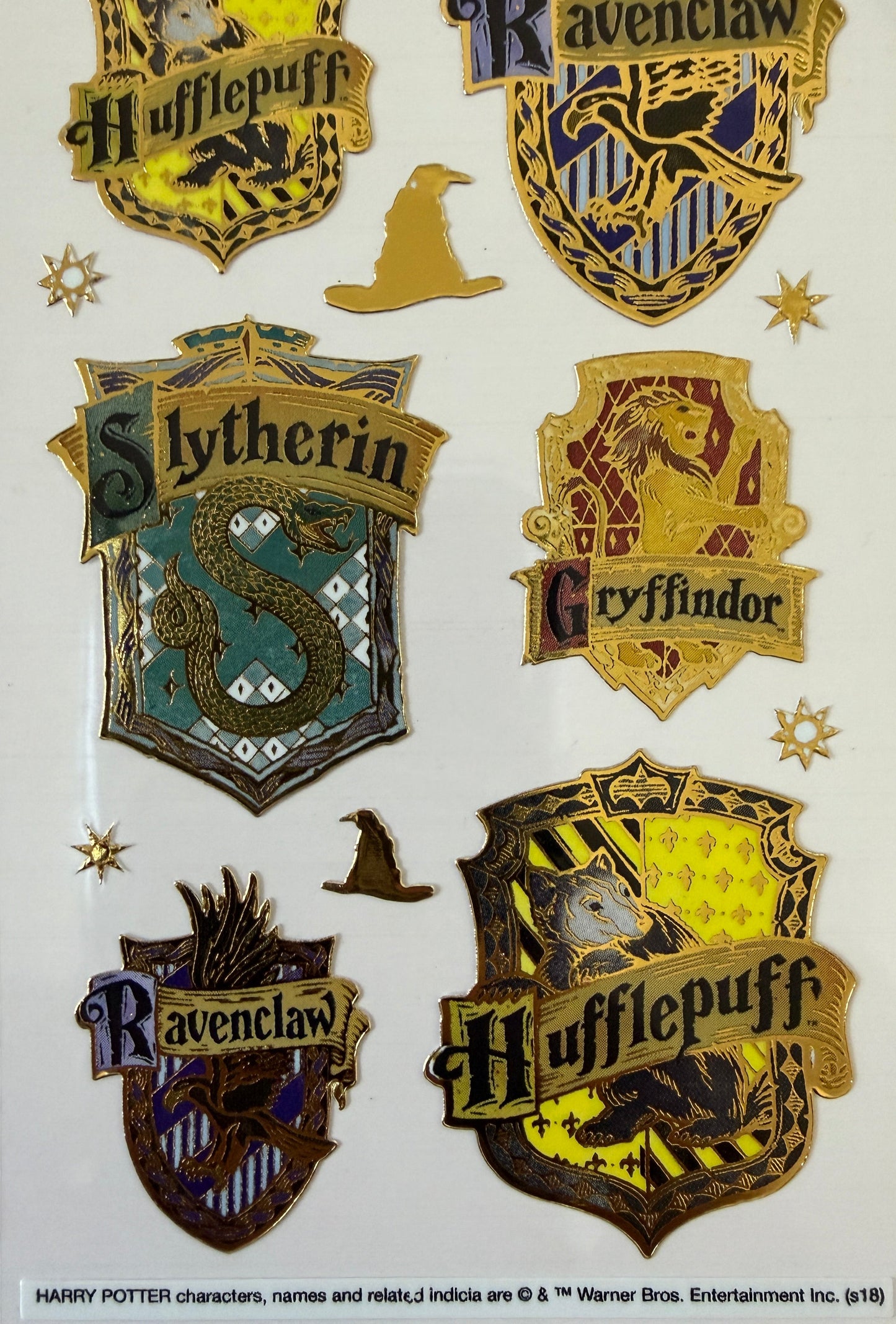 Close-up of enamel-effect Harry Potter stickers on backing card