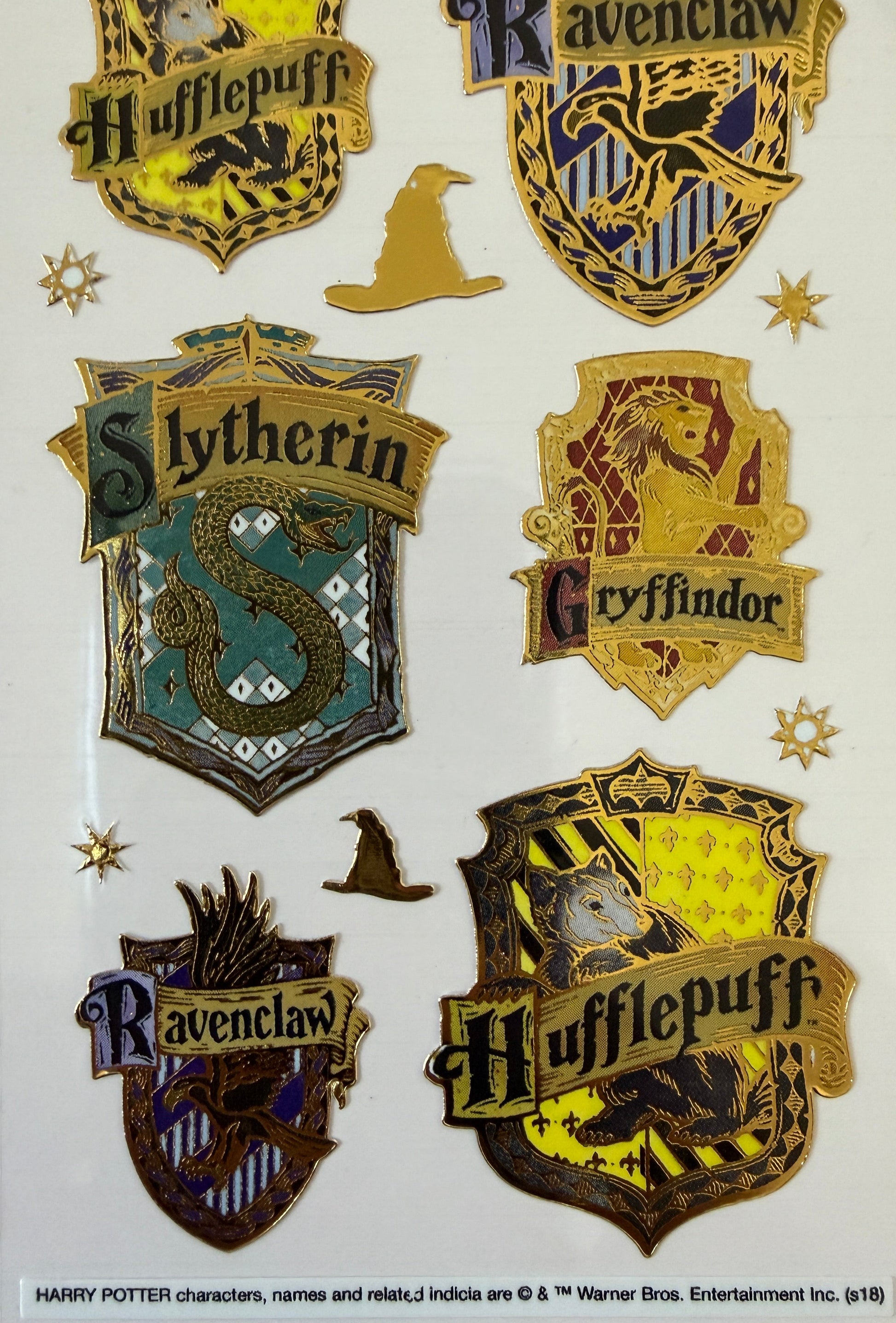Close-up of enamel-effect Harry Potter stickers on backing card
