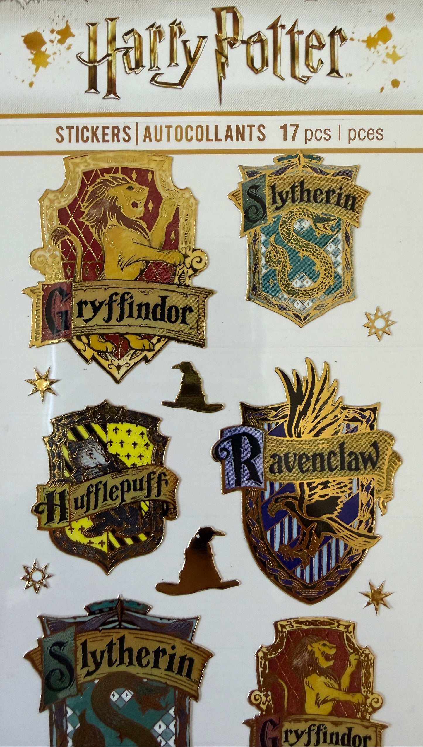 Close-up of enamel-effect Harry Potter stickers on backing card