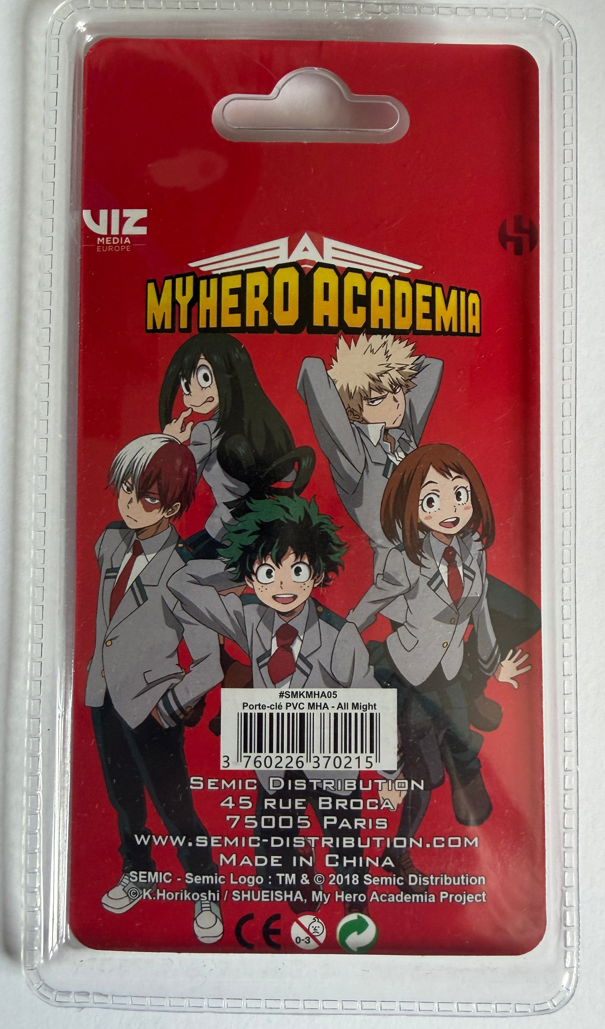 A packaged My Hero Academia collectible figure card on a red backing card inside a clear plastic blister pack. The card features characters Deku, Todoroki, Iida, and others in school uniforms, with the 'My Hero Academia' title at the top and SEMIC Distribution branding at the bottom.