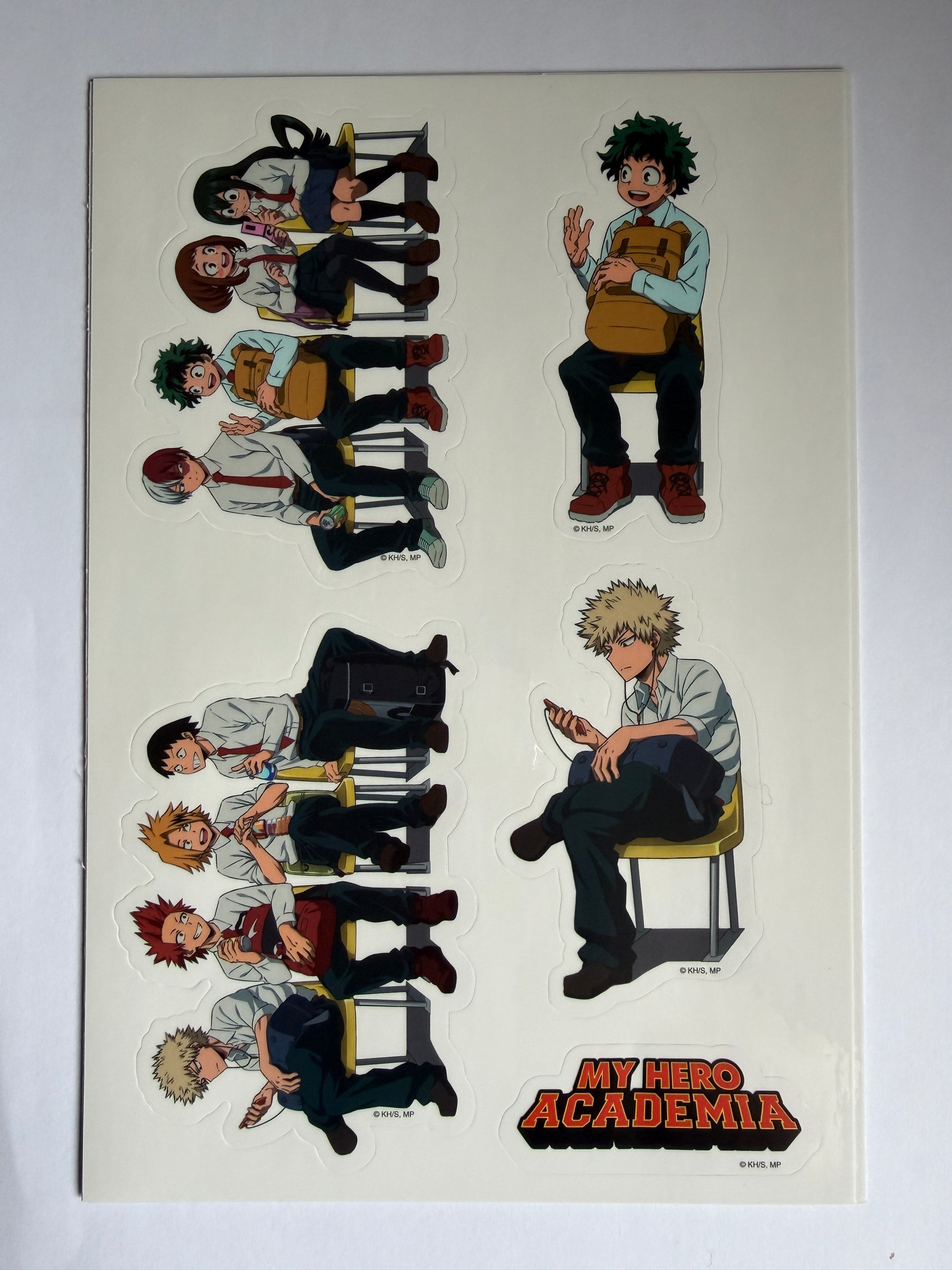 Illustration of characters from 'My Hero Academia' in a classroom setting on a white background.
