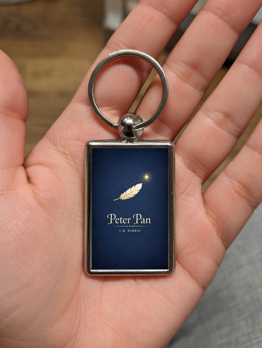 Peter Pan metal keyring shown in a hand