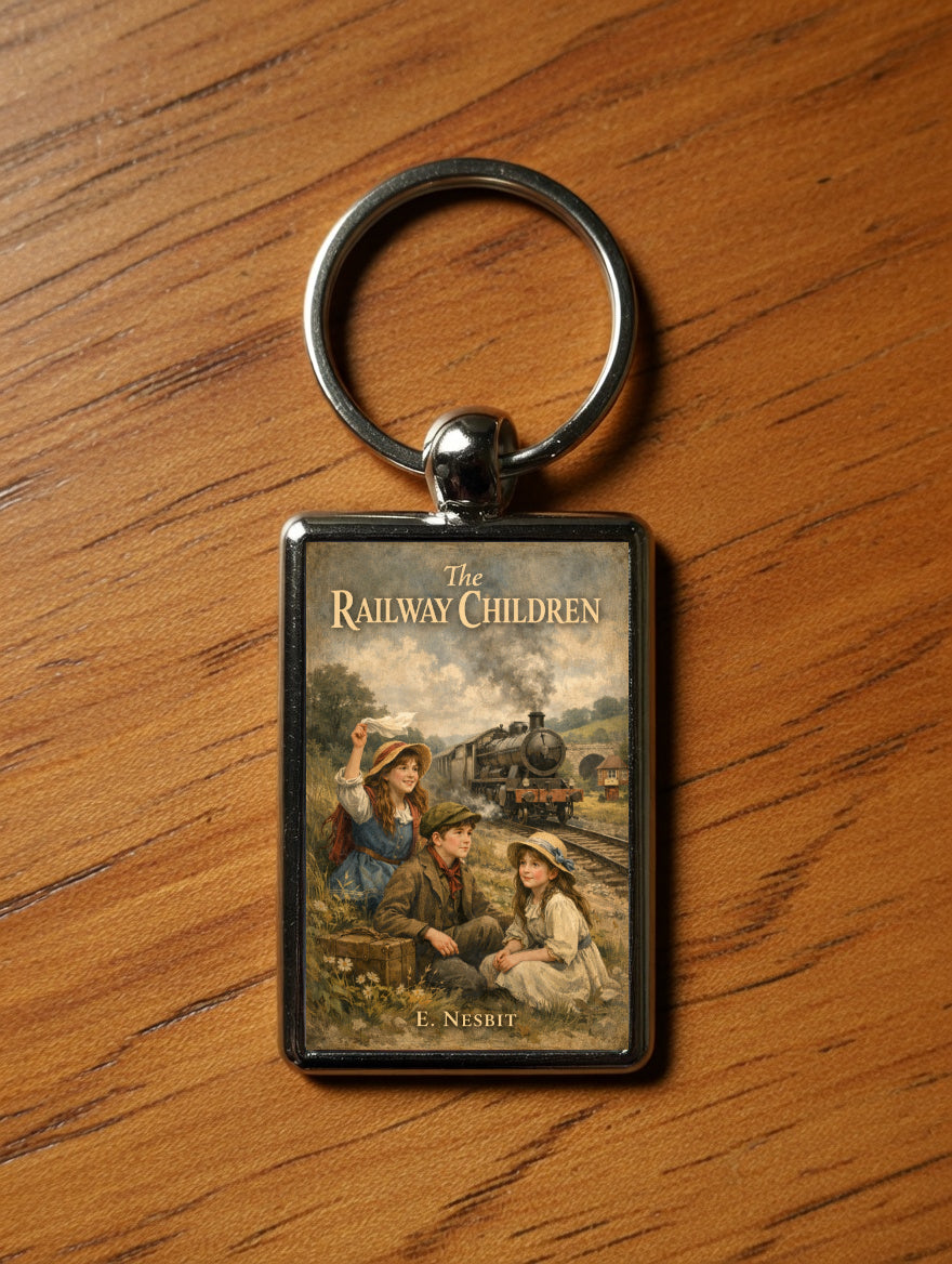 The Railway Children metal keyring on a wooden table