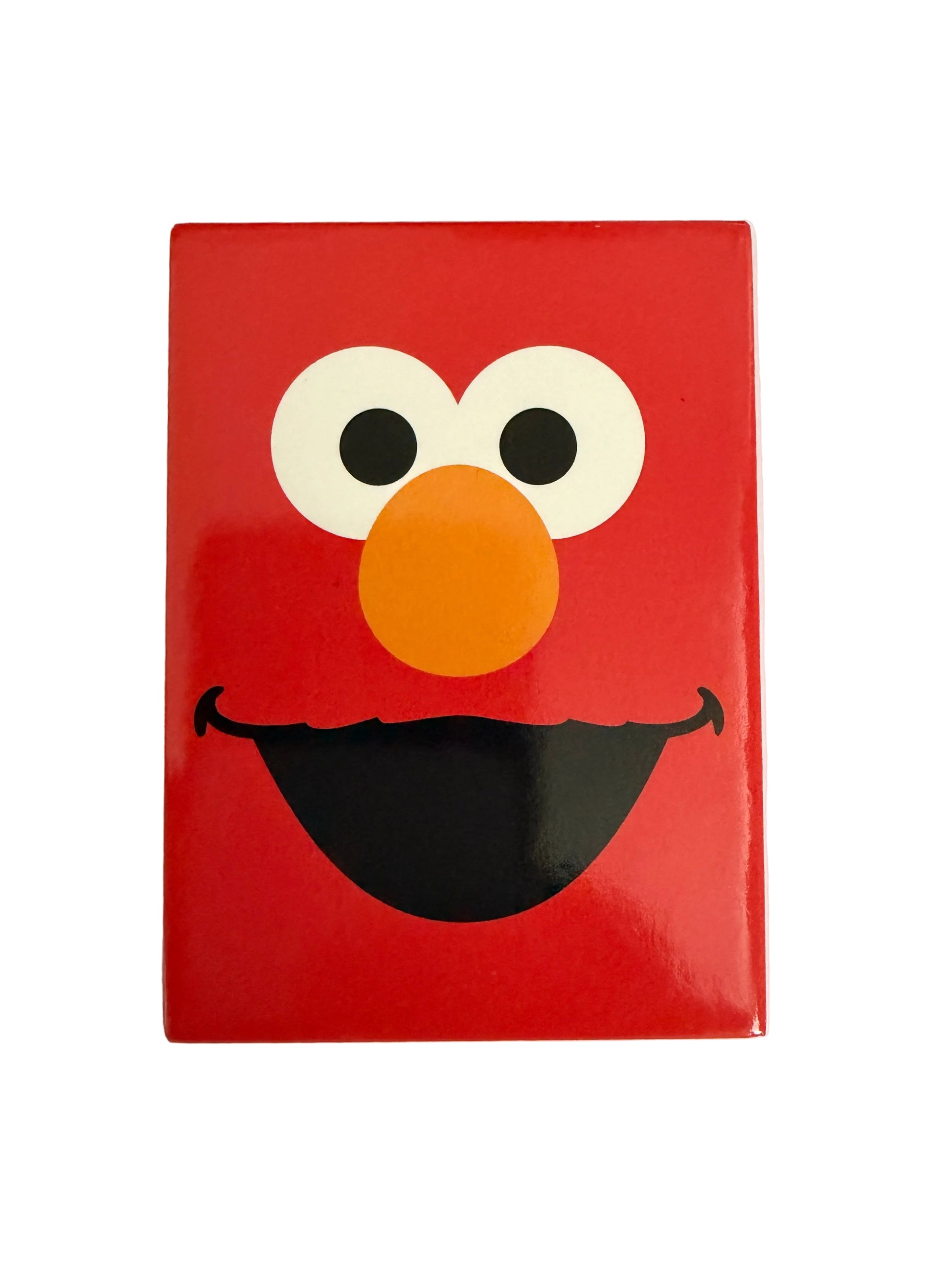 Red rectangular Elmo fridge magnet on a white background