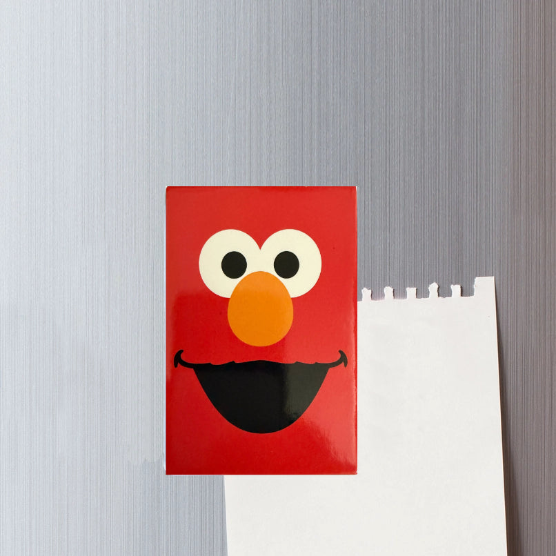 Elmo cartoon face design on a gray background