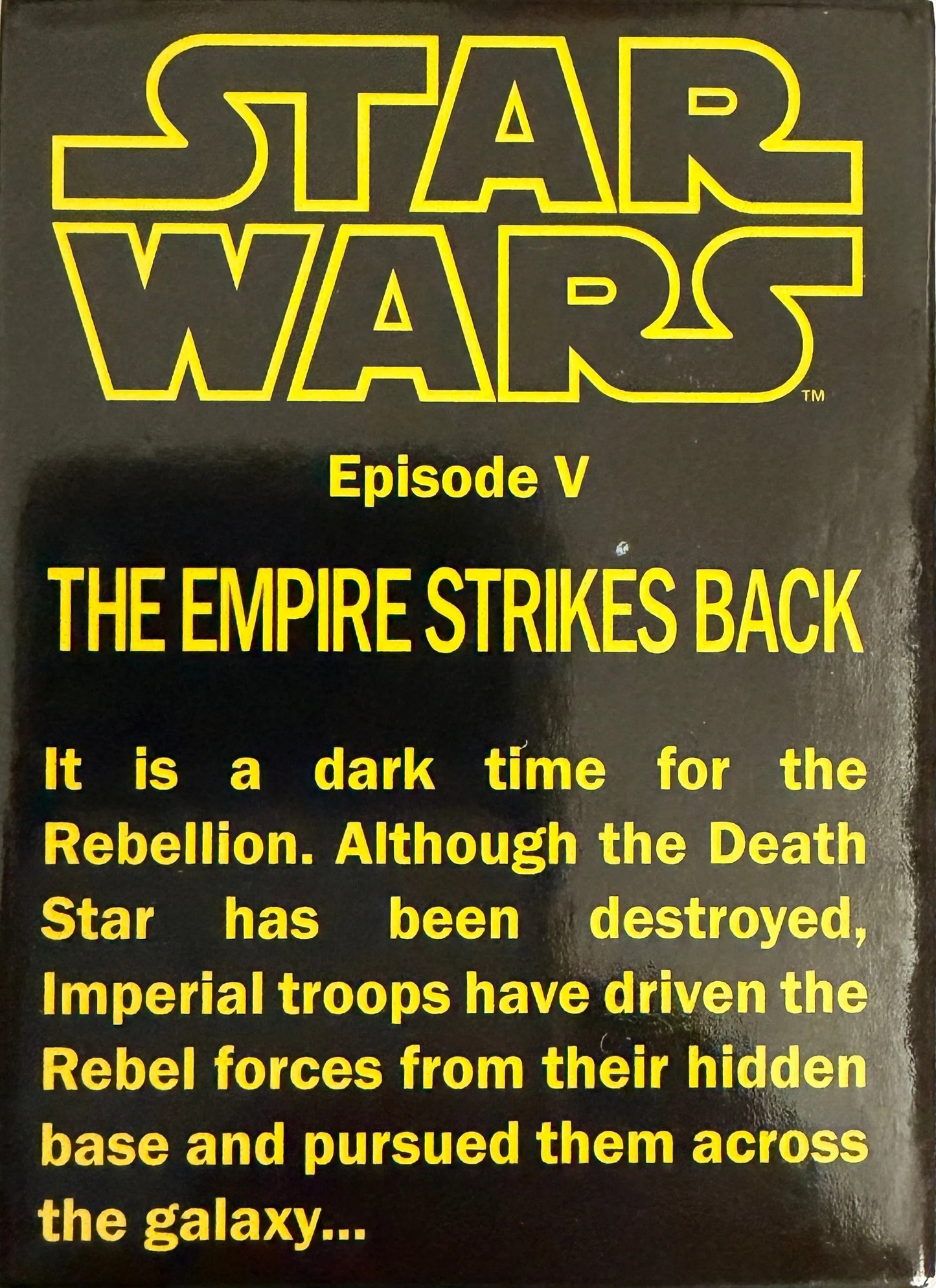 Vintage 'Star Wars' movie poster with yellow text on a black background