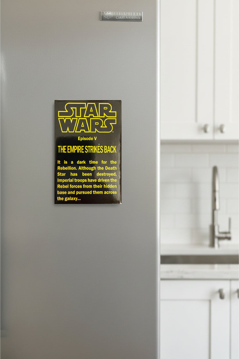 Star Wars poster on a refrigerator with kitchen cabinets in the background