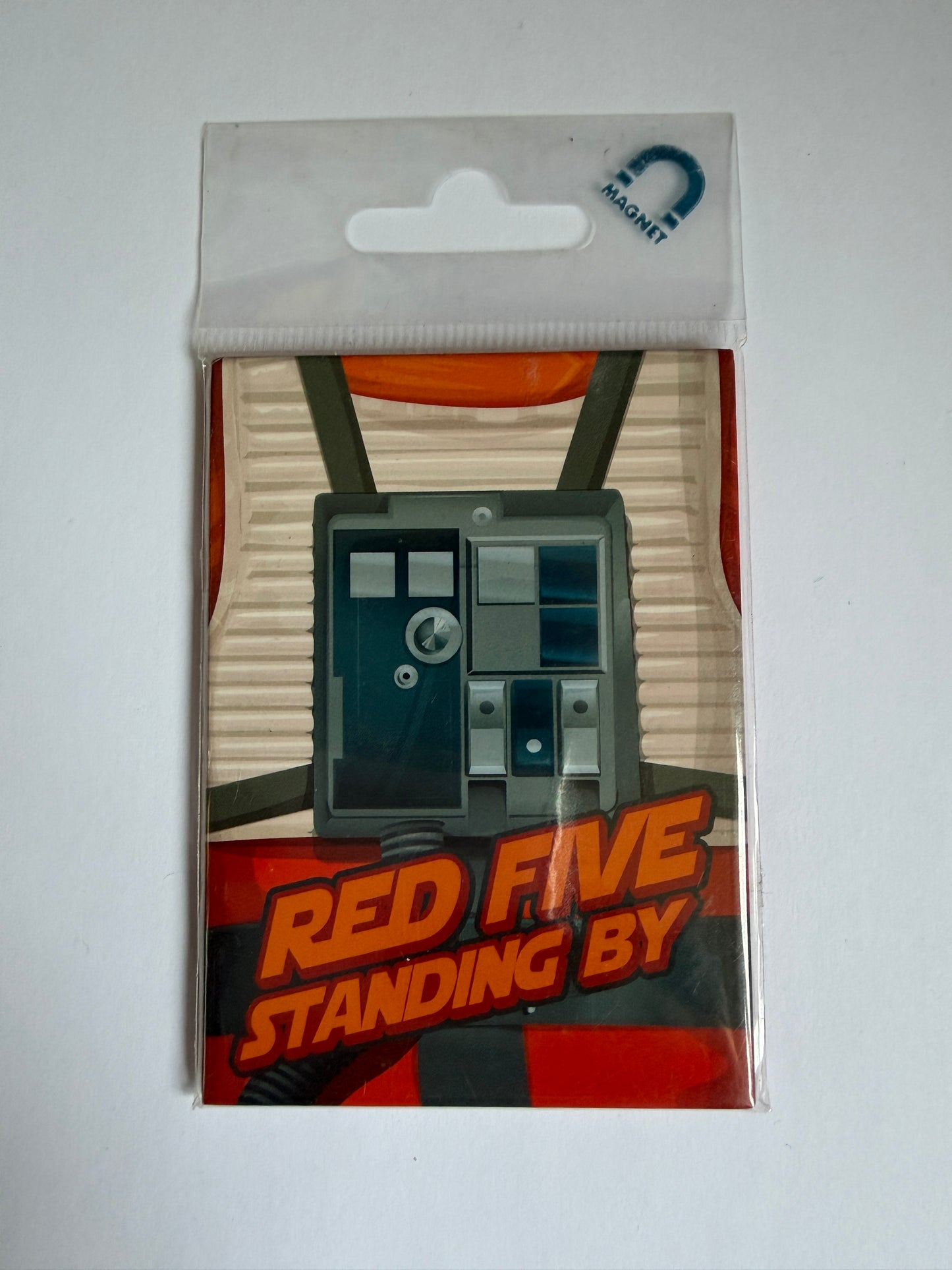 Product packaging with a game piece and text 'Red Five Standing By' on a white background
