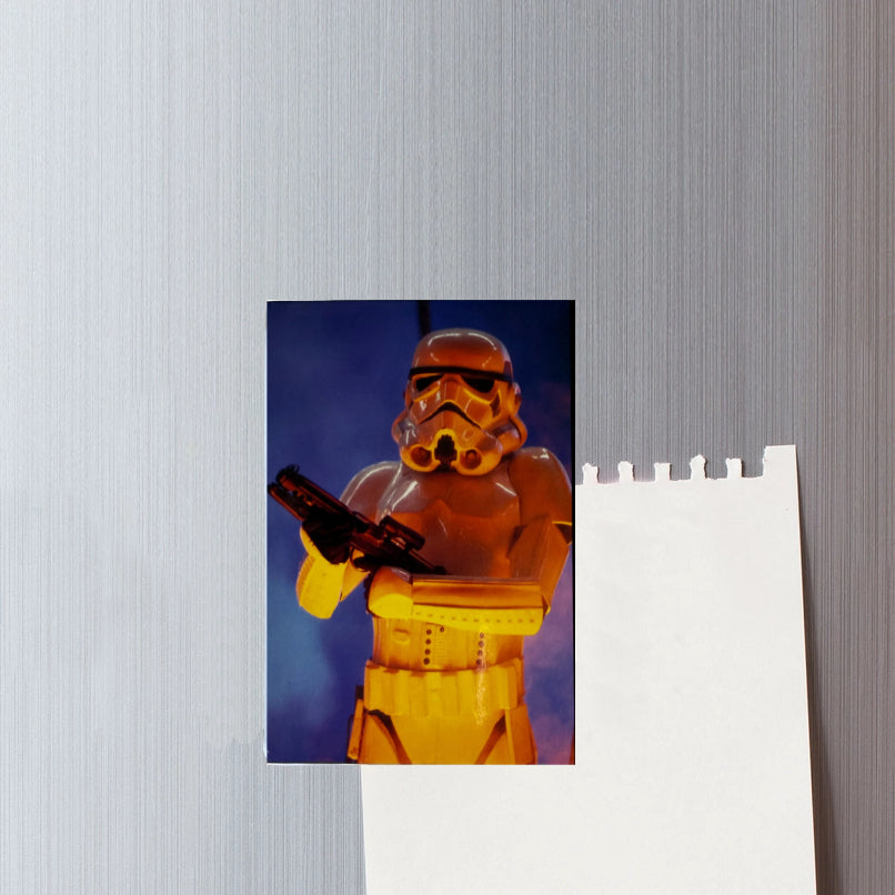 Fridge Magnet with a stormtrooper figure on a textured wall.