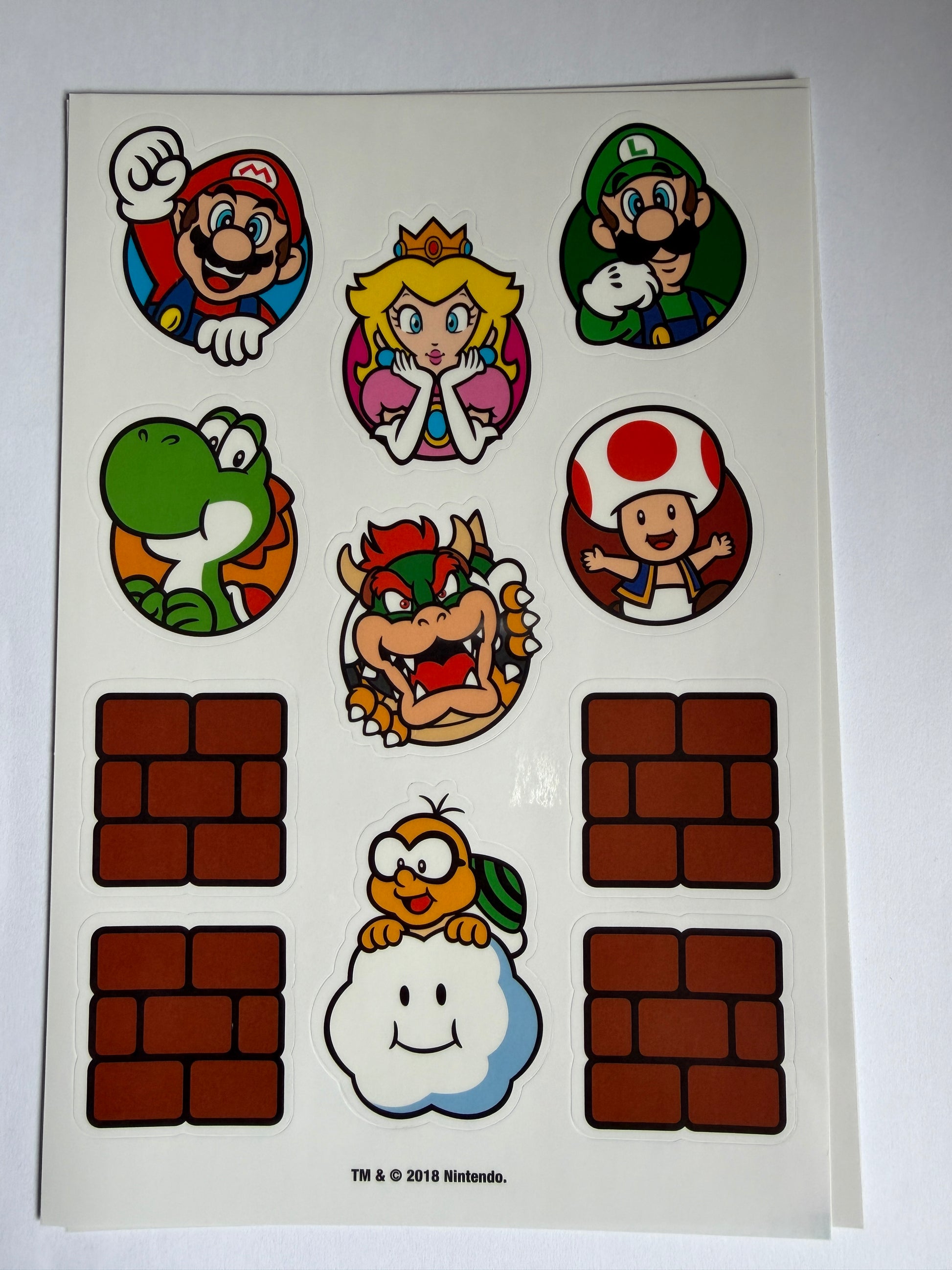 Sheet of stickers featuring cartoon characters and blocks on a white background
