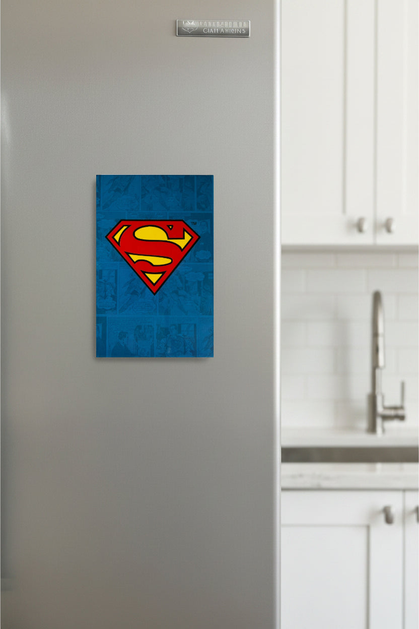 Superman logo magnet on a refrigerator in a kitchen setting