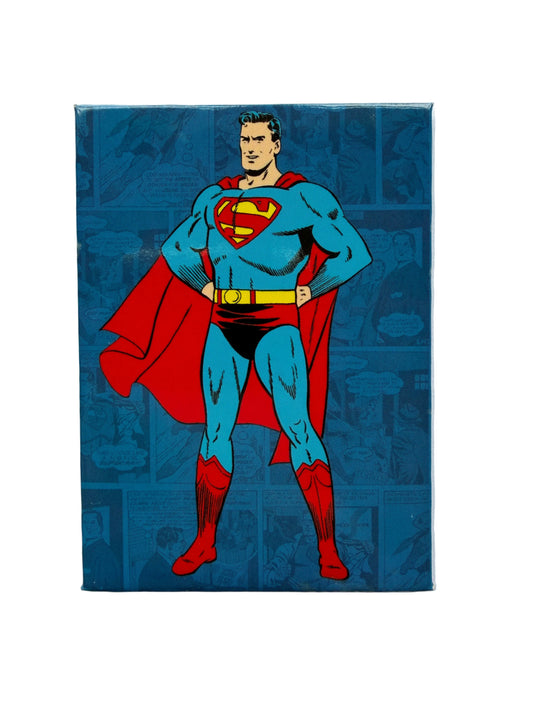 Superman character on a blue background with superhero emblem