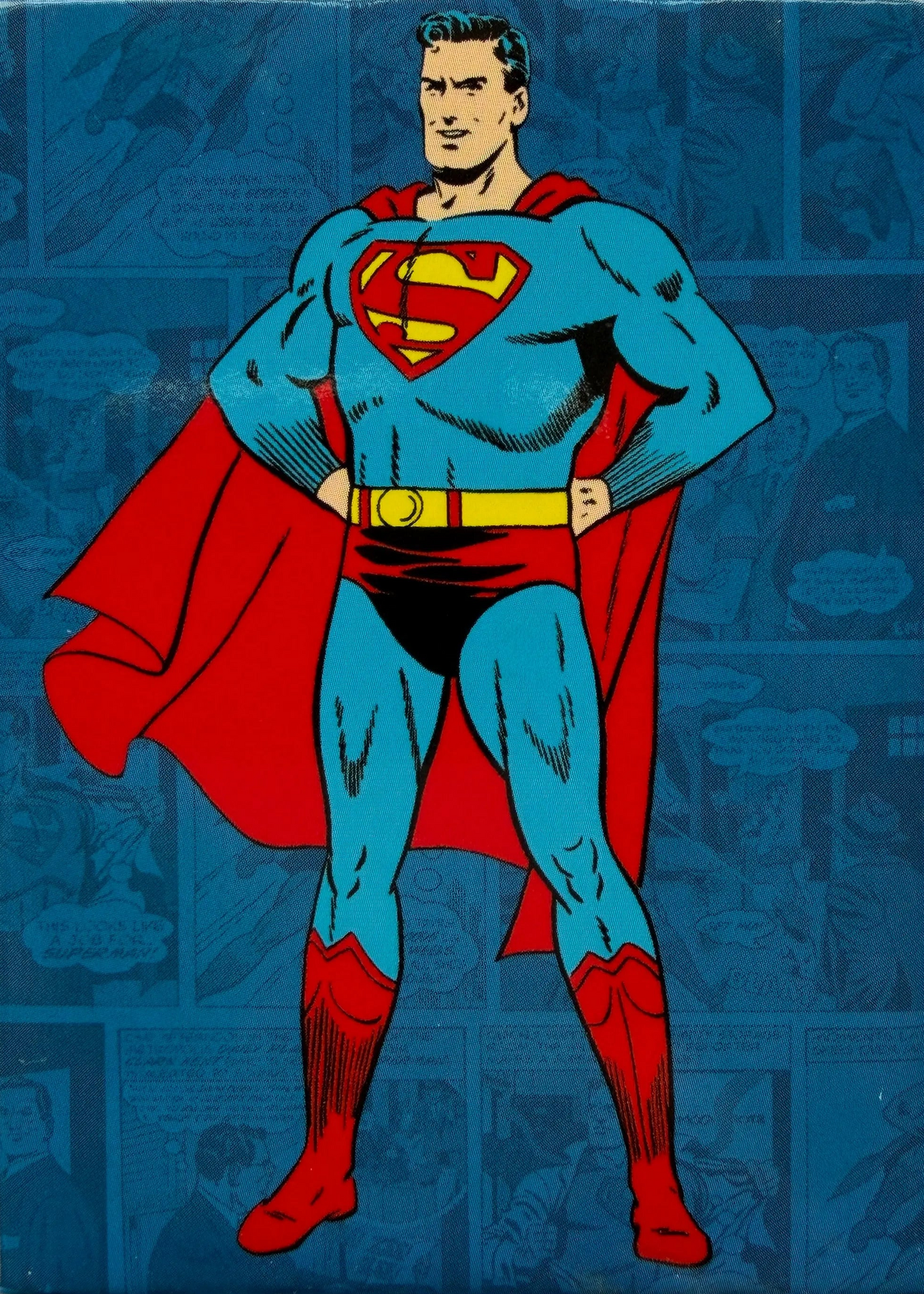 Superman character in blue suit with red cape and boots on a comic book background
