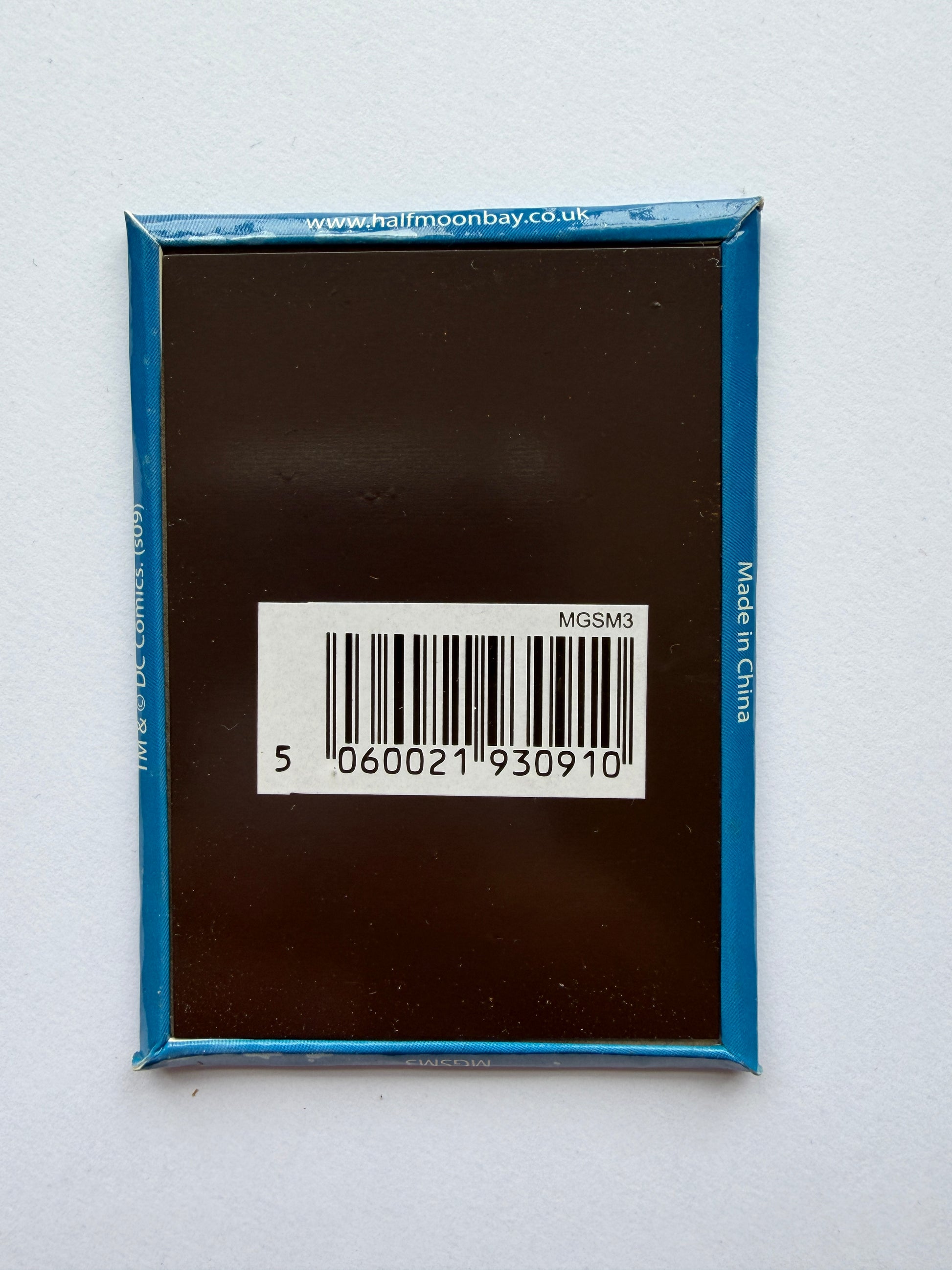 Bar code on a black product packaging with blue border on a white background