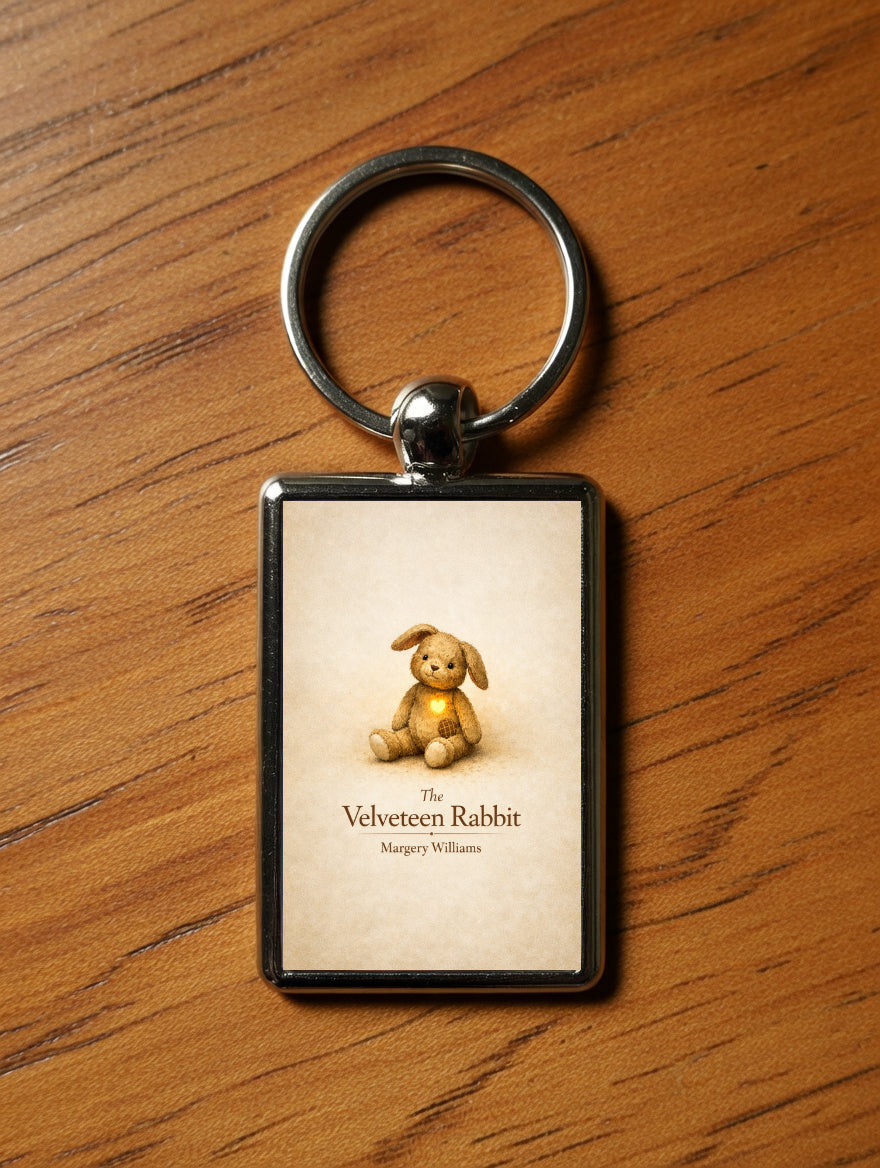 The Velveteen Rabbit metal keyring on a wooden table