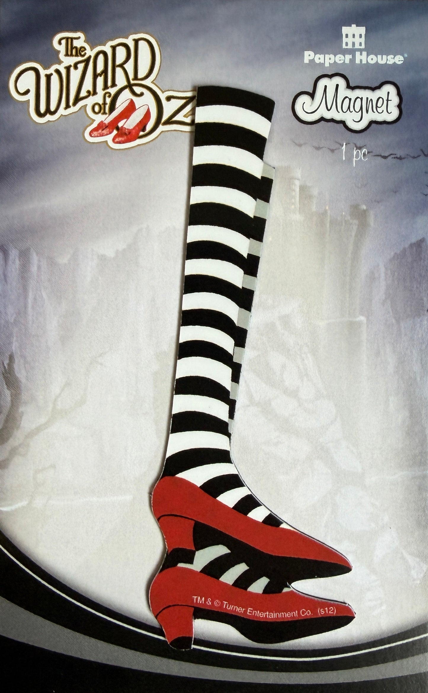 Black and white striped shoe with red accents on a white background, featuring 'The Wizard of Oz' branding.
