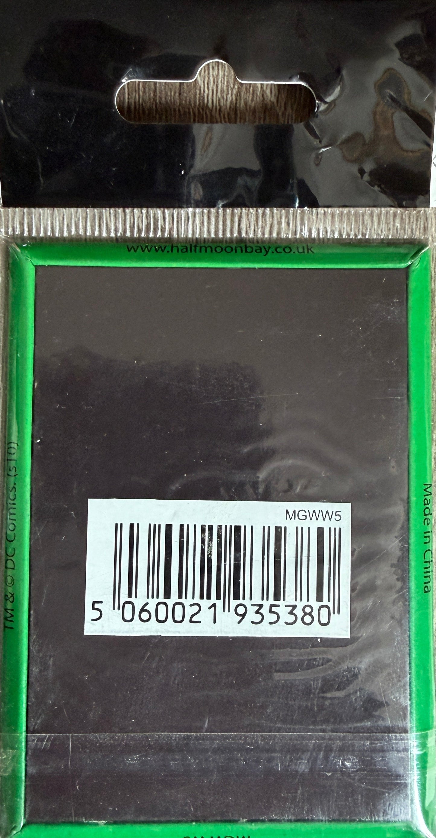 Bar code label on a reflective surface with a green border