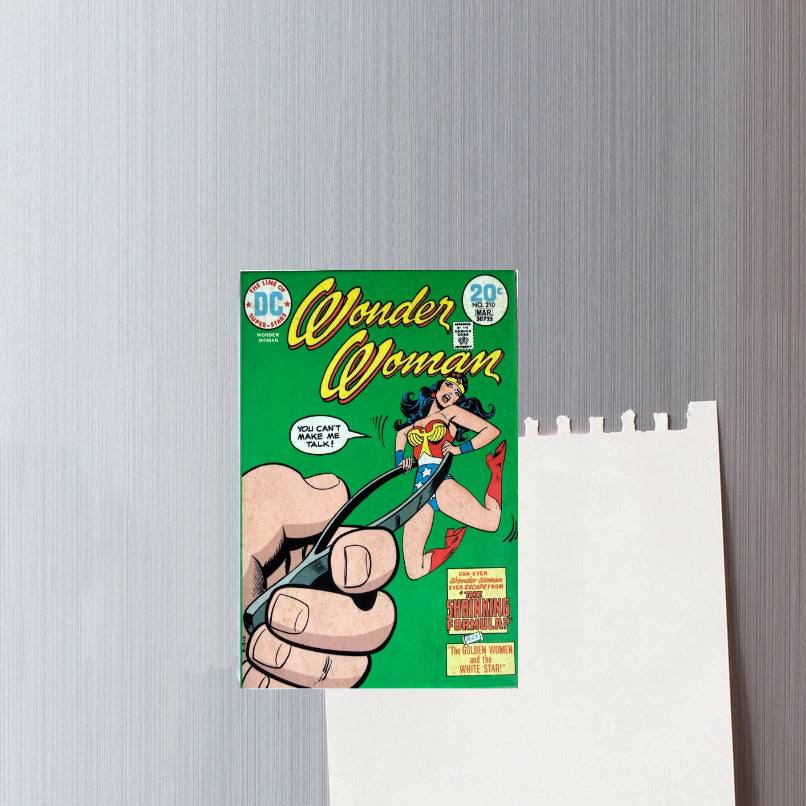 Comic book cover of Wonder Woman on a gray wall