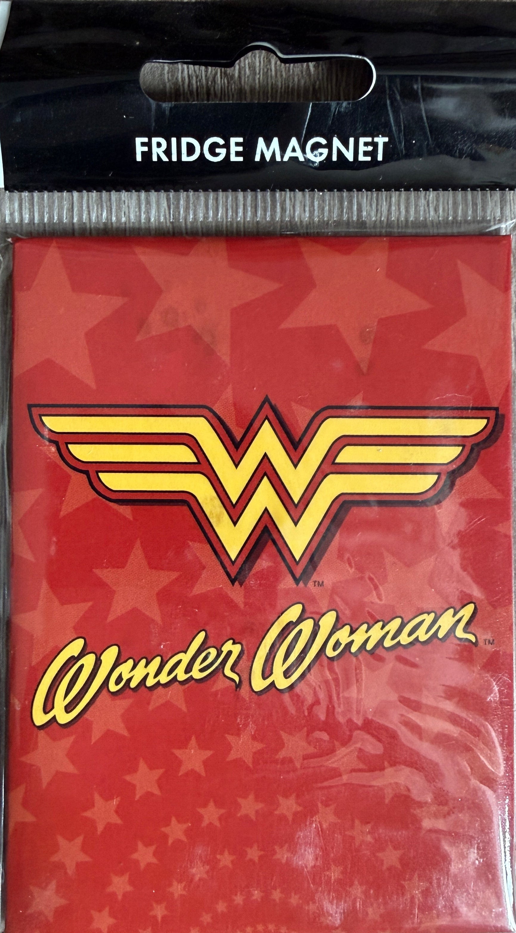 Wonder Woman fridge magnet packaging with red background and yellow logo