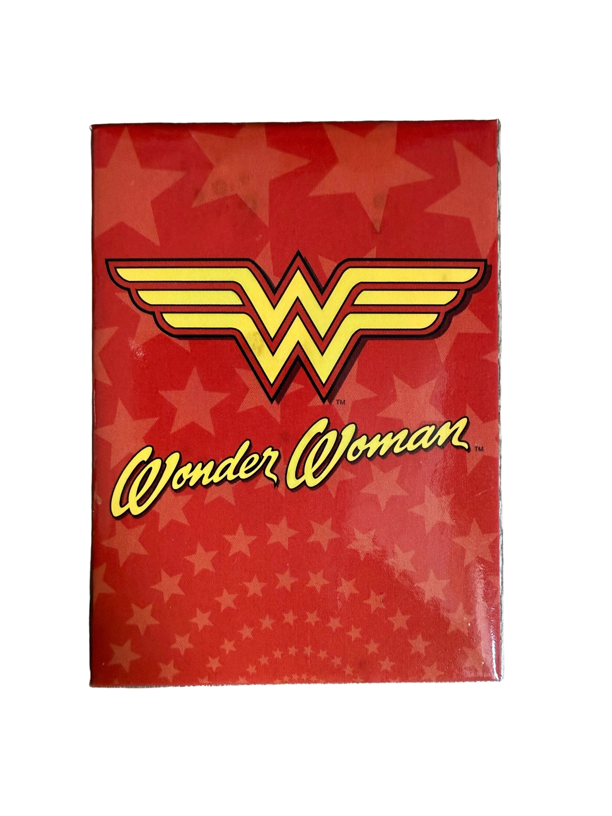 Red card with Wonder Woman logo and text on a star-patterned background