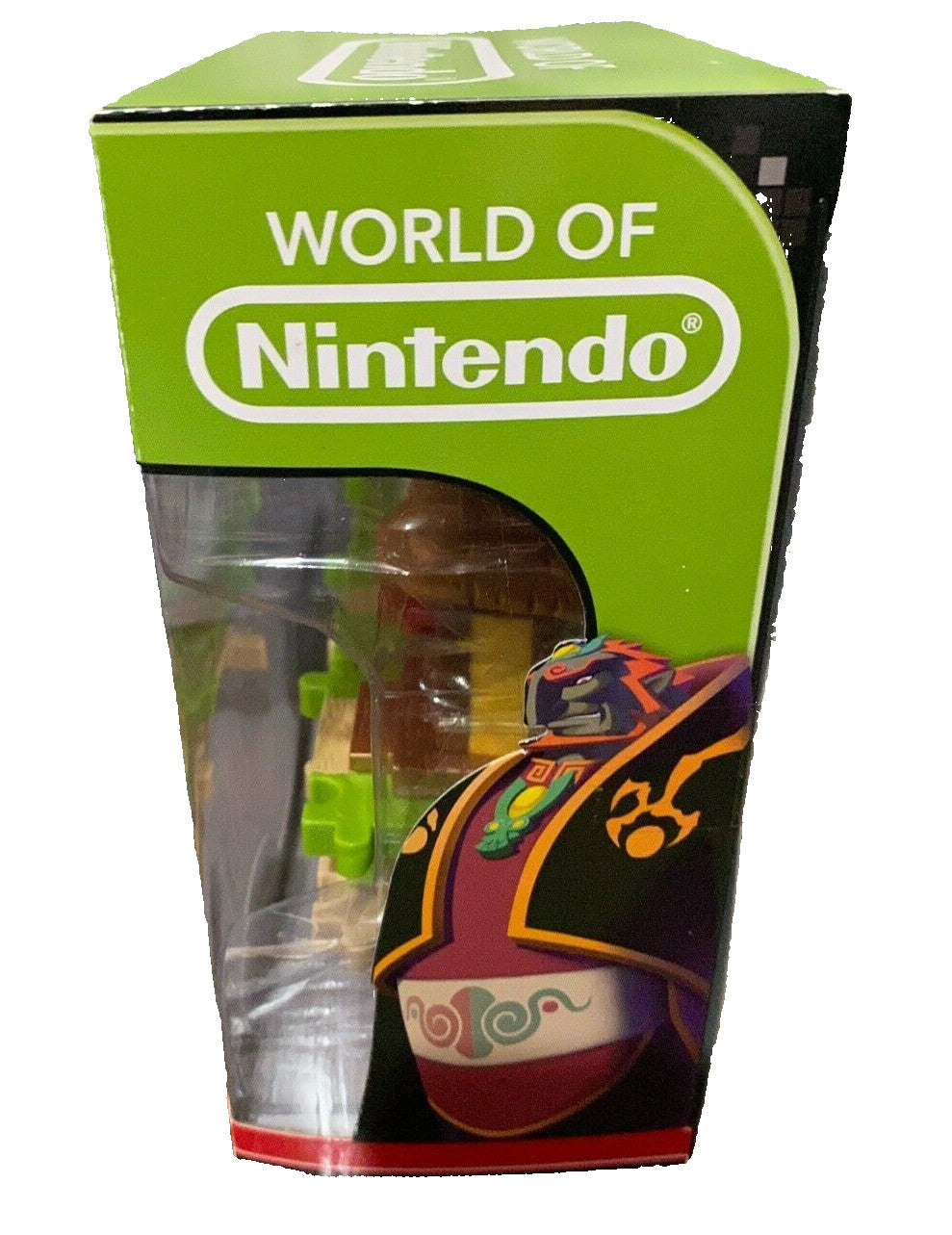 Product packaging with 'World of Nintendo' branding on a wooden surface.