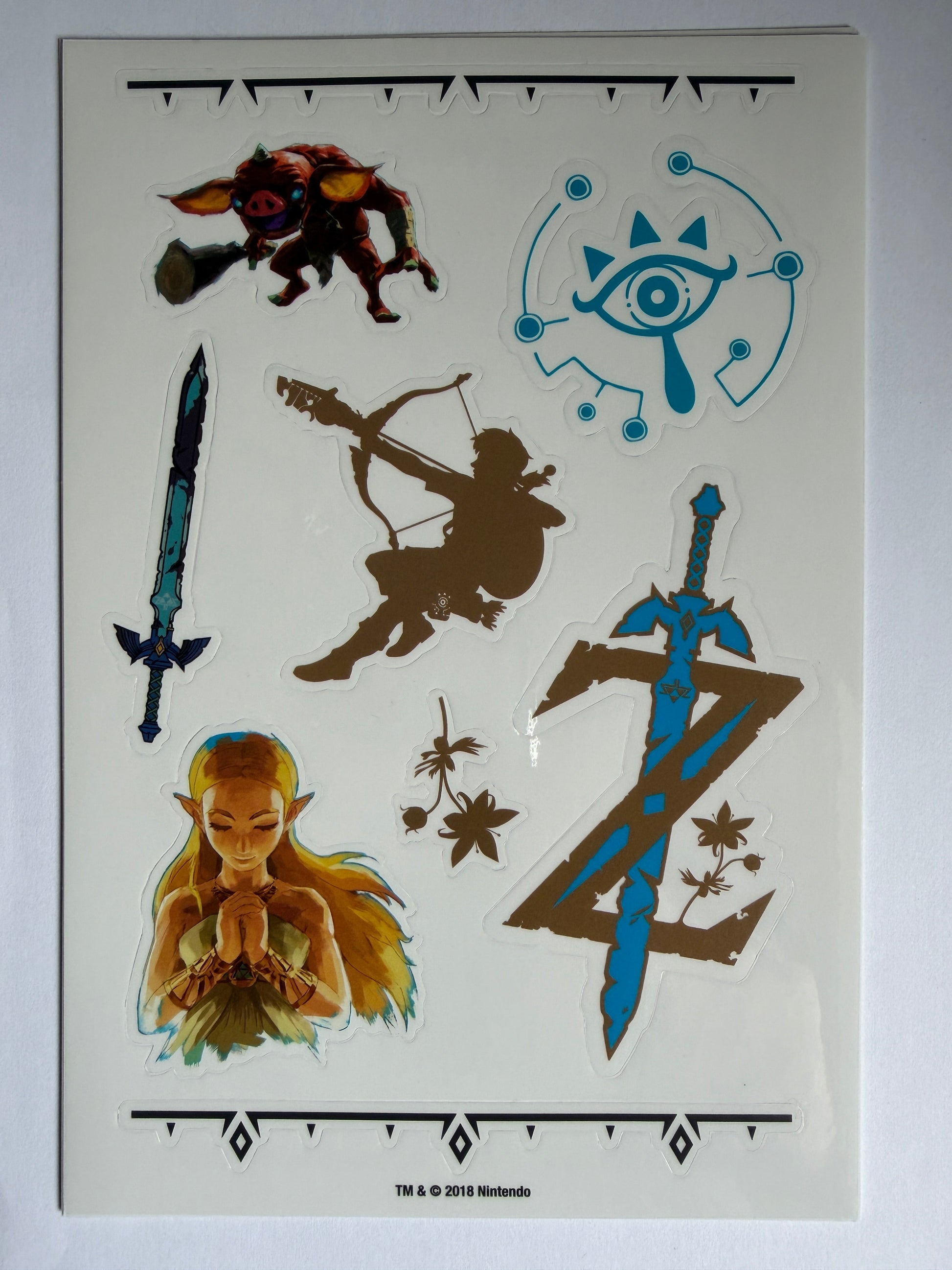 Sheet of stickers featuring fantasy characters and symbols on a white background.